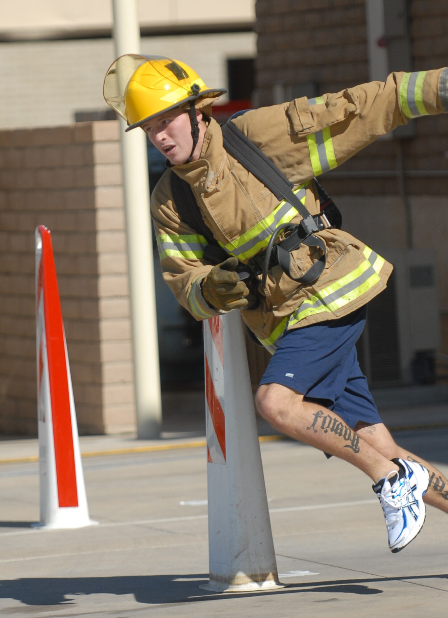 Airman 1st Class Sean Venesky, 56th Civil Engineer Squadron firefighter, runs through the obstacle course during the Firefighter Combat Challenge held at the Luke Air Force Base Fire Station, October 16, 2009. (U.S. Air Force photo by Airman 1st Class Sandra Welch)