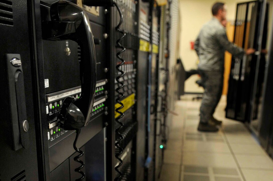 ELLSWORTH AIR FORCE BASE, S.D.--(Left) Tech. Sgt. Jason Willson, 28th Communications Squadron radar maintenance NCO in-charge and Airman 1st Class Gary Isabelle, 28th Communications Squadron radar maintenance technician, view the status of the Digital Airport Surveillance Radar, Oct. 14. The DASR technology is the newest available technology and it uses less power, requires less maintenance and manpower, and costs significantly less to operate than other systems currently in use. (U.S. Air Force photo/Airman 1st Class Corey Hook)