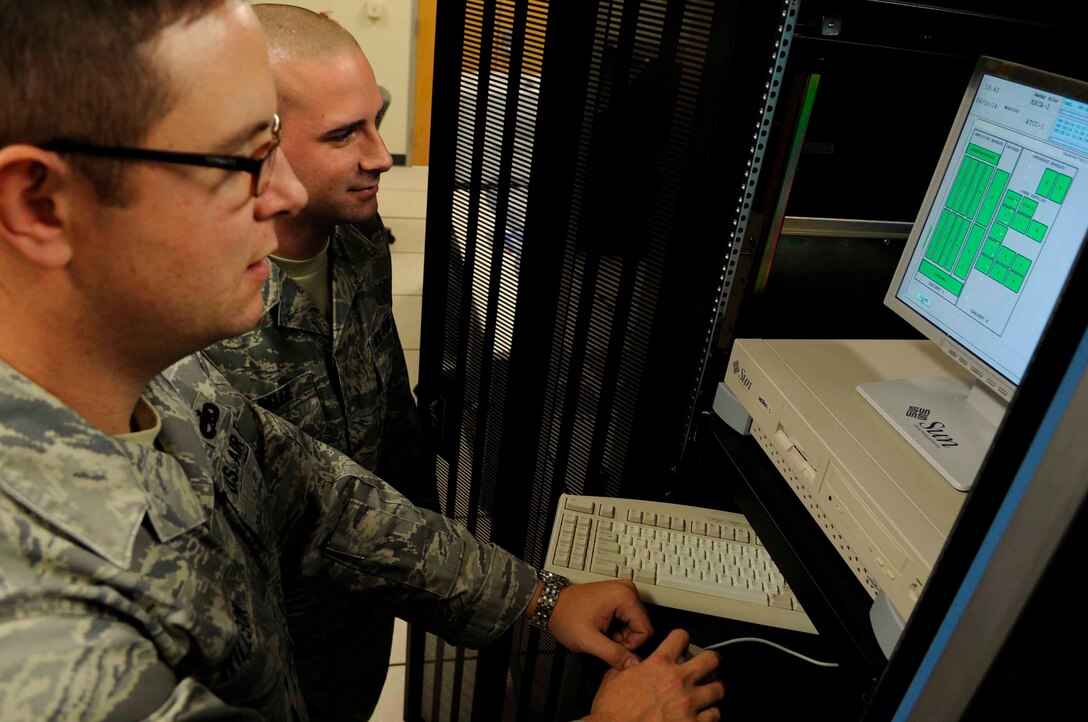 ELLSWORTH AIR FORCE BASE, S.D.--(Left) Tech. Sgt. Jason Willson, 28th Communications Squadron radar maintenance NCO in-charge and Airman 1st Class Gary Isabelle, 28th Communications Squadron radar maintenance technician, view the status of the Digital Airport Surveillance Radar, Oct. 14. The DASR technology is the newest available technology and it uses less power, requires less maintenance and manpower, and costs significantly less to operate than other systems currently in use. (U.S. Air Force photo/Airman 1st Class Corey Hook)