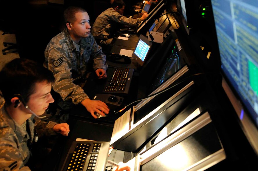 ELLSWORTH AIR FORCE BASE, S.D.--(Left) Airman 1st Class Ryan Anger and Staff Sgt. Jacob Martin, 28th Operations Support Squadron air traffic controllers, manage air traffic, Oct. 14. The DASR technology is the newest available technology and it uses less power, requires less maintenance and manpower, and costs significantly less to operate than other systems currently in use. (U.S. Air Force photo/Airman 1st Class Corey Hook)