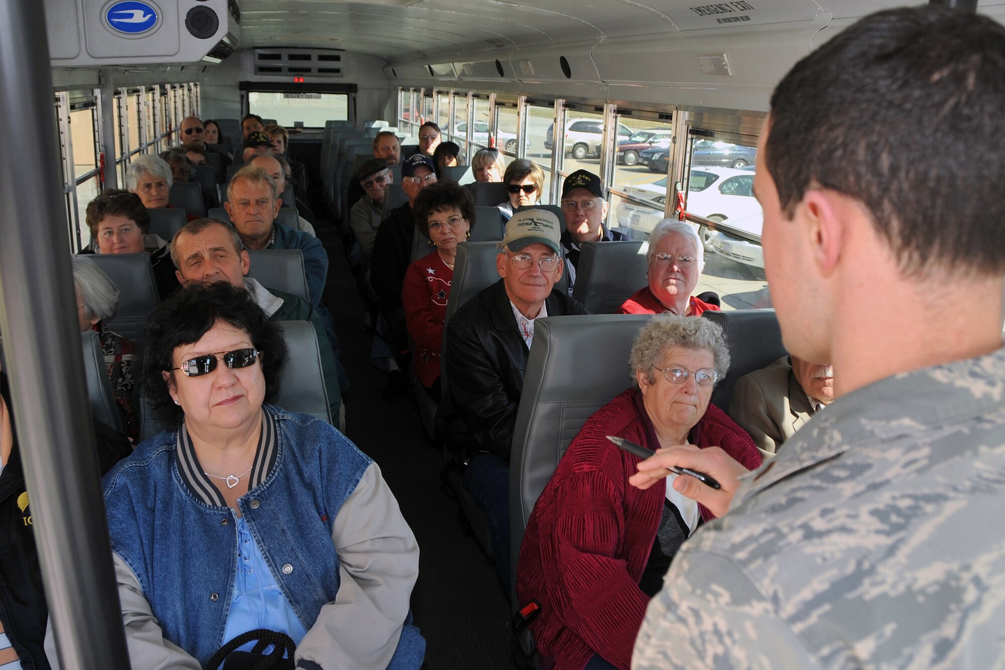 OFFUTT AIR FORCE BASE, Neb. - 2nd Lt. Ken Scholz, 55th Wing Public Affairs chief of community relations,  talks to retirees and their families prior to an historic and current mission driving tour of the base during Offutt's Retiree Appreciation Day Oct. 18. During the annual appreciation day, retirees and their families were offered a variety of information and services, including flu shots and new identification cards.  U.S. Air Force Photo by Jeff W. Gates.