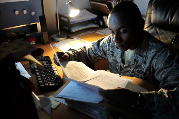 SOUTHWEST ASIA -1st Lt. James Carpenter, 380th Expeditionary Contracting Squadron contracting officer, reviews purchase requests here Oct. 20, 2009. Lieutenant Carpenter is deployed from Misawa Air Base, Japan, and hails from Virginia Beach, Va. (U.S. Air Force photo/Tech. Sgt. Charles Larkin Sr)
