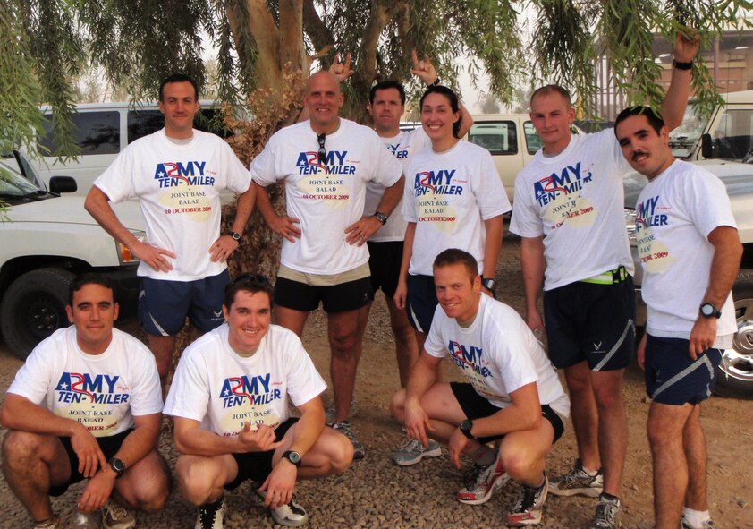 JOINT BASE BALAD, Iraq -- Nine members of the 64th Expeditionary Rescue Squadron ran in the Army 10-miler road race here Oct. 10 at Joint Base Balad, Iraq, in an effort to prepare for new Air Force fitness requirements. Front row (from left): Tech. Sgt. Jeremy Diola, Staff Sgt. Airman Josh Kruse and Senior Airman Nate Simonson Back row: Lt. Col. Steve Gregg, Master Sgt. Louis Distelzweig, Capt. Luke Bates, 1st Lt. Erin Hannon, Senior Airman Guy Coggins and Capt. Anibal Aguirre. 