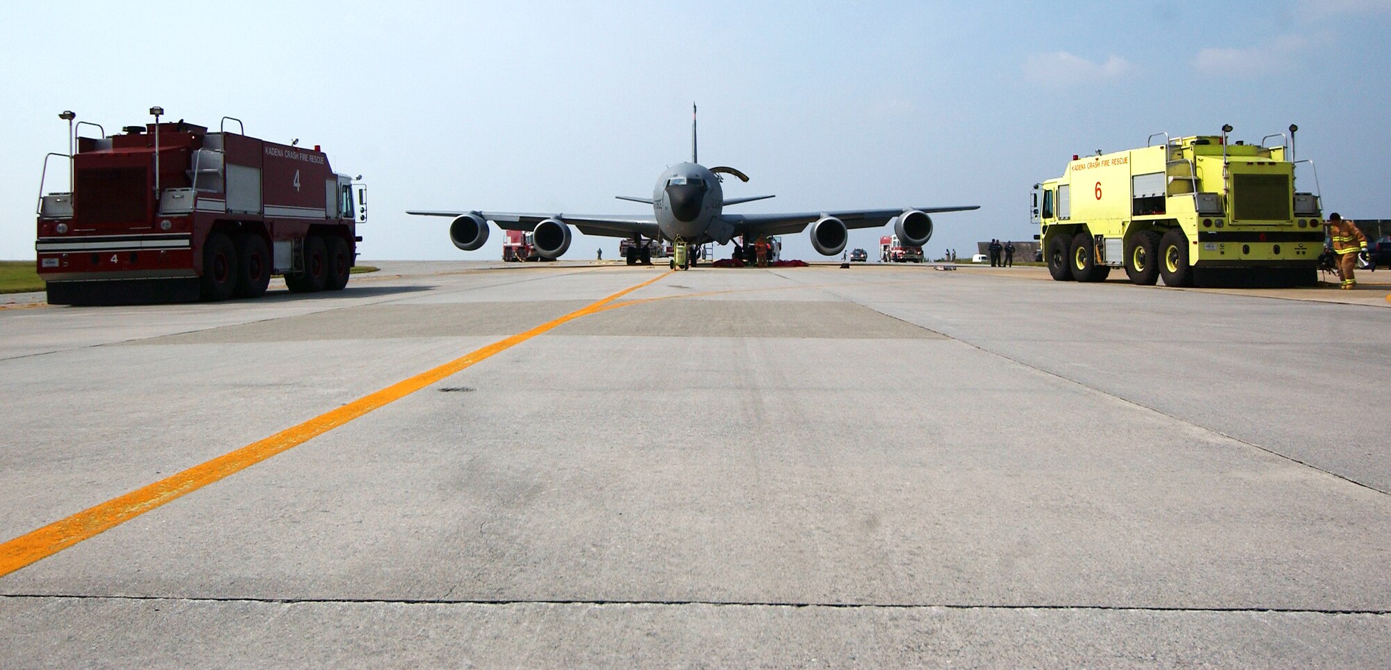 First responders arrive at the scene during a scenario involving a fire aboard a KC-135 Stratotanker at Kadena Air Base, Japan Oct. 19 during Exercise Beverly High 10-01. The 18th Wing is participating in a Local Operational Readiness Exercise to test the readiness of Kadena Airmen Oct.19-23.     
(U.S. Air Force photo/Tech. Sgt. Rey Ramon)            
                                                   
                              