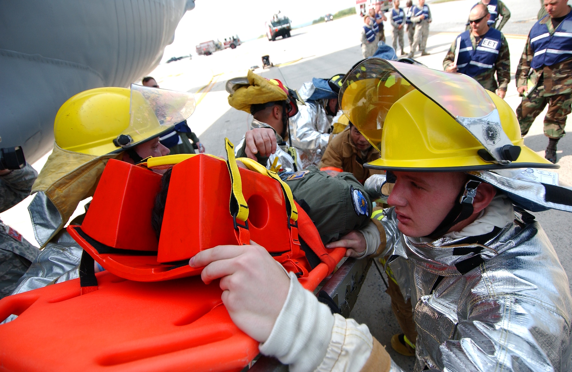 The Kadena Fire Department extract the injured victims in a scenario involving a KC-135 Stratotanker experiencing a fire at Kadena Air Base, Japan Oct. 19 during Exercise Beverly High 10-01. The 18th Wing is participating in a Local Operational Readiness Exercise to test the readiness of Kadena Airmen Oct. 19-23.      
(U.S. Air Force photo/Tech. Sgt. Rey Ramon)           
                              