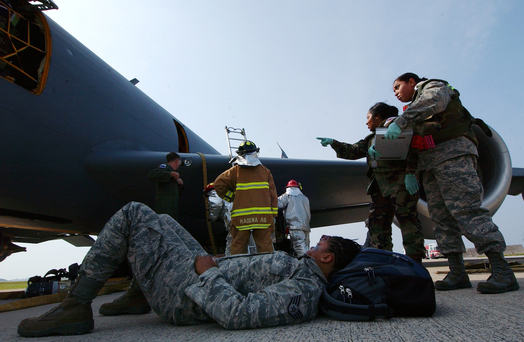 Airmen from the 18th Medical Group provide care to injured victims in a
scenario involving a fire aboard a KC-135 Stratotanker at Kadena Air Base,
Japan Oct. 19 during Exercise Beverly High 10-01. The 18th Wing is
participating in a Local Operational Readiness Exercise to test the
readiness of Kadena Airmen Oct. 19-23.   (U.S. Air Force photo/Tech. Sgt.
Rey Ramon)   