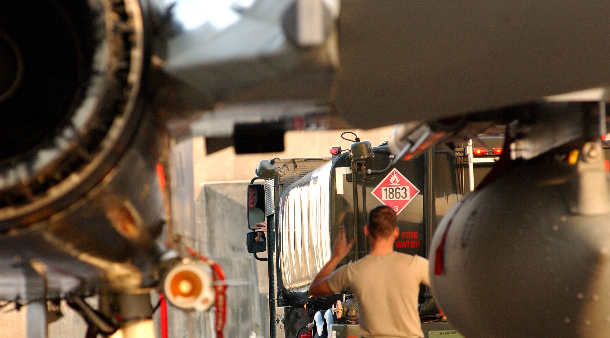 An Airman from the 44th Aircraft Maintenance Unit guides a fuel truck after completing inspections on an F-15  at Kadena Air Base, Japan Oct. 19 during Exercise Beverly High 10-01. The 18th Wing is participating in a Local Operational Readiness Exercise to test the readiness of Kadena Airmen Oct. 19-23.   
(U.S. Air Force photo/Tech. Sgt. Rey Ramon)      
                                                 