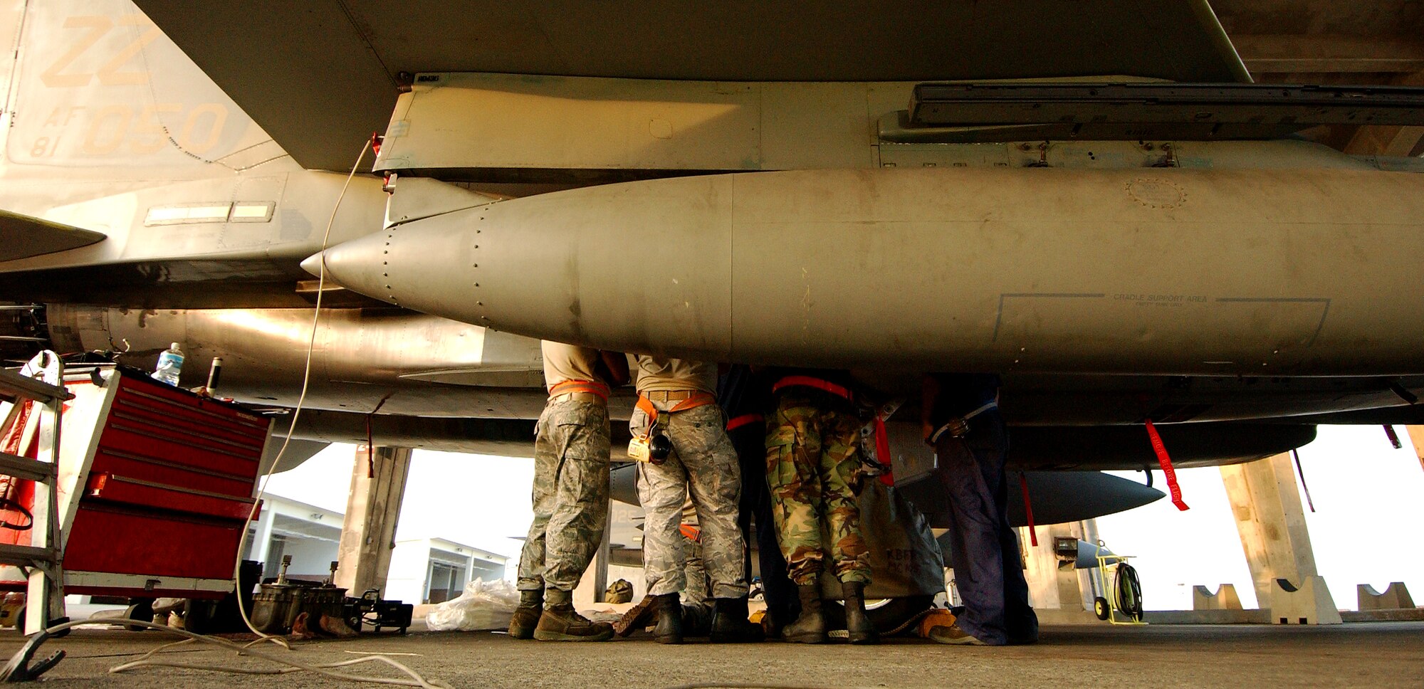 Airmen from the 67th Aircraft Maintenance Unit practice removing and installing a utility reservoir on an F-15 at Kadena Air Base, Japan Oct. 19 during Exercise Beverly High 10-01. The 18th Wing is participating in a Local Operational Readiness Exercise to test the readiness of Kadena Airmen Oct. 19-23.   
(U.S. Air Force photo/Tech. Sgt. Rey Ramon)
                                                 