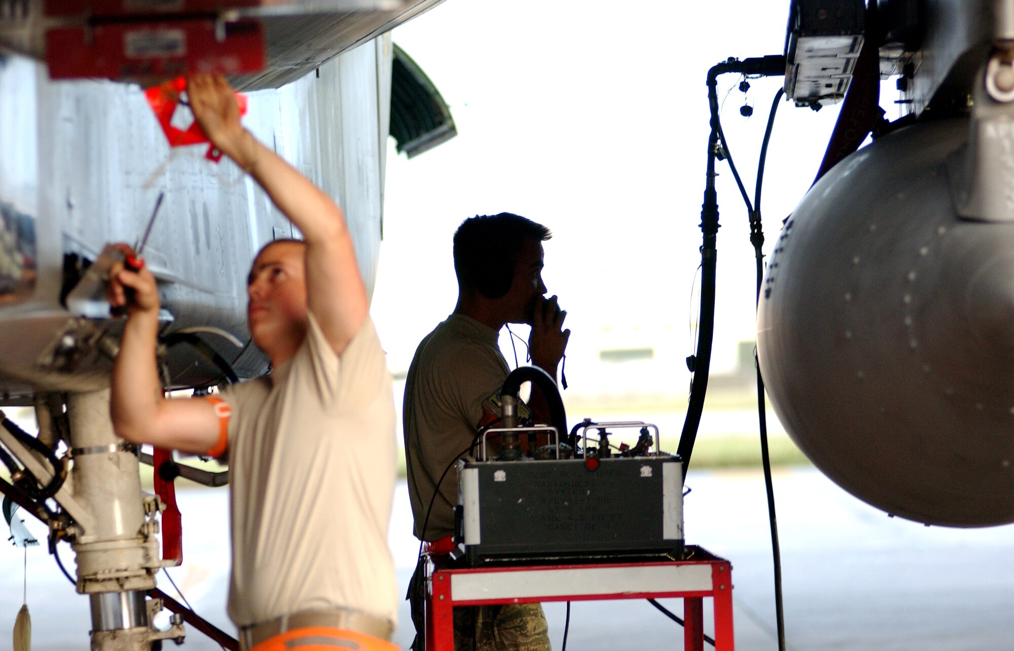 Airmen from the 67th Aircraft Maintenance Unit inspect an F-15 at Kadena Air Base, Japan Oct. 19 during Exercise Beverly High 10-01. The 18th Wing is participating in a Local Operational Readiness Exercise to test the readiness of Kadena Airmen Oct. 19-23.   (U.S. Air Force photo/Tech. Sgt. Rey Ramon) 
                                                 