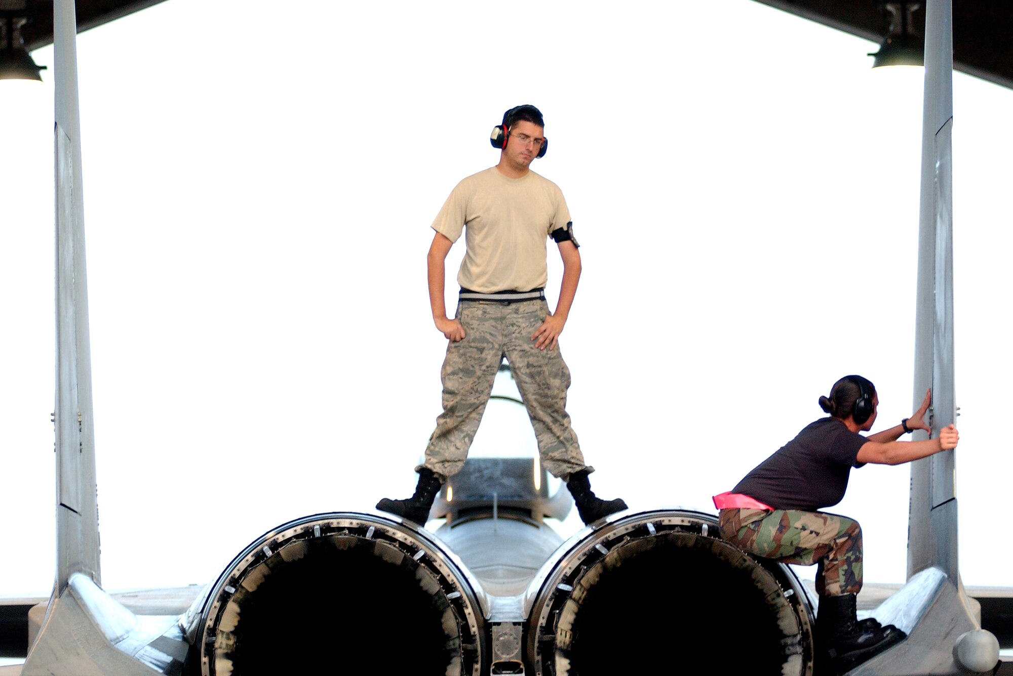 Airmen from the 67th Aircraft Maintenance Unit inspect an F-15 at Kadena Air Base, Japan Oct. 19 during Exercise Beverly High 10-01. The 18th Wing is participating in a Local Operational Readiness Exercise to test the readiness of Kadena Airmen Oct. 19-23.  (U.S. Air Force photo/Tech. Sgt. Rey Ramon)   
                                                 