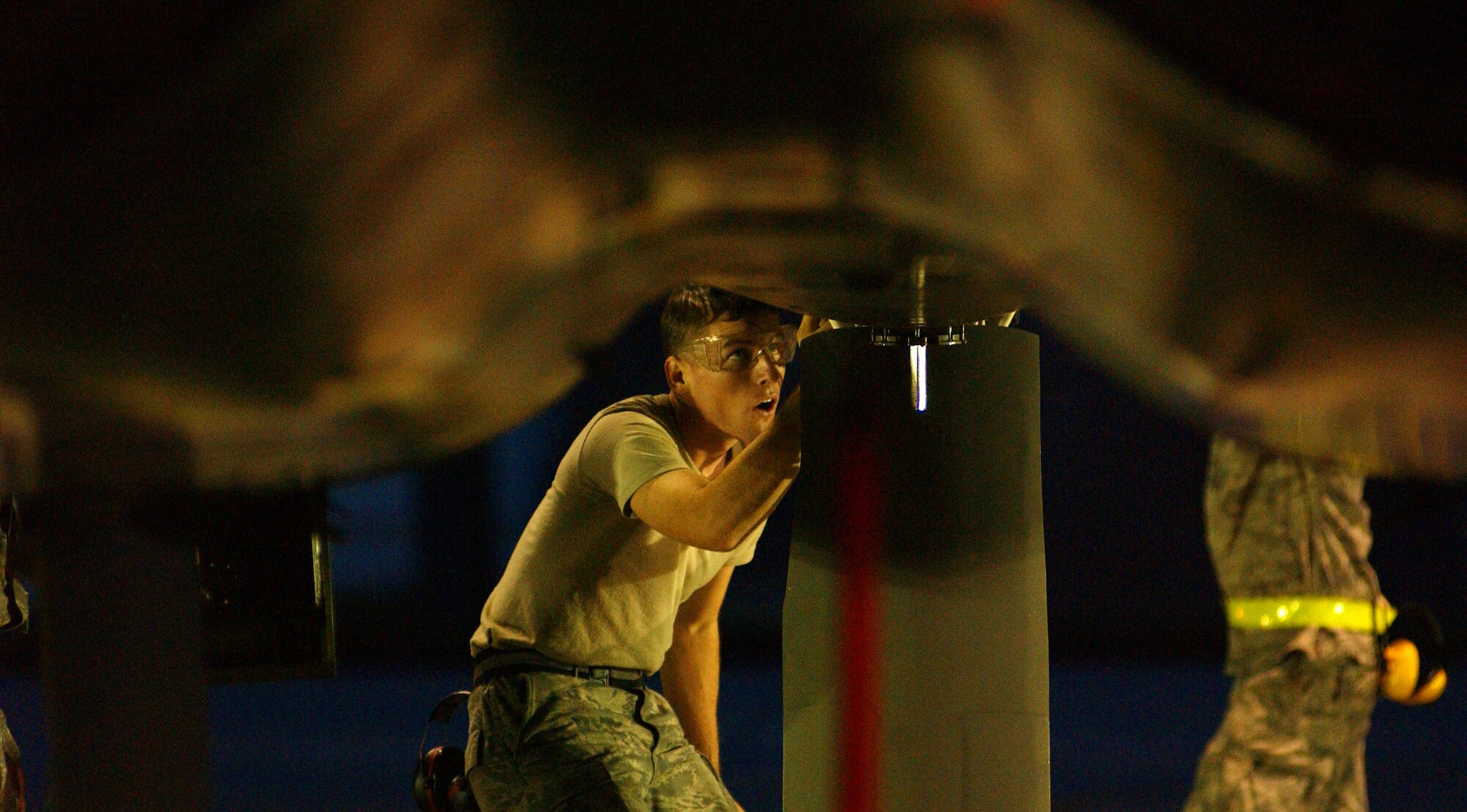 An Airman from the 44th Aircraft Maintenance Unit conducts preflight inspections on an F-15 in the early morning hours at Kadena Air Base, Japan Oct. 19 during Exercise Beverly High 10-01. The 18th Wing is participating in a Local Operational Readiness Exercise to test the readiness of Kadena Airmen Oct. 19-23.  
(U.S. Air Force photo/Tech. Sgt. Rey Ramon)     
                                                 