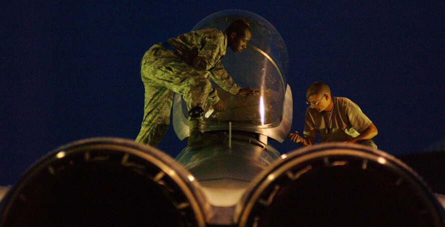 Airmen from the 44th Aircraft Maintenance Unit inspect an F-15 in the early morning hours at Kadena Air Base, Japan Oct. 19 during Exercise Beverly High 10-01. The 18th Wing is participating in a Local Operational Readiness Exercise to test the readiness of Kadena Airmen Oct. 19-23.  
(U.S. Air Force photo/Tech. Sgt. Rey Ramon)    
                                                 