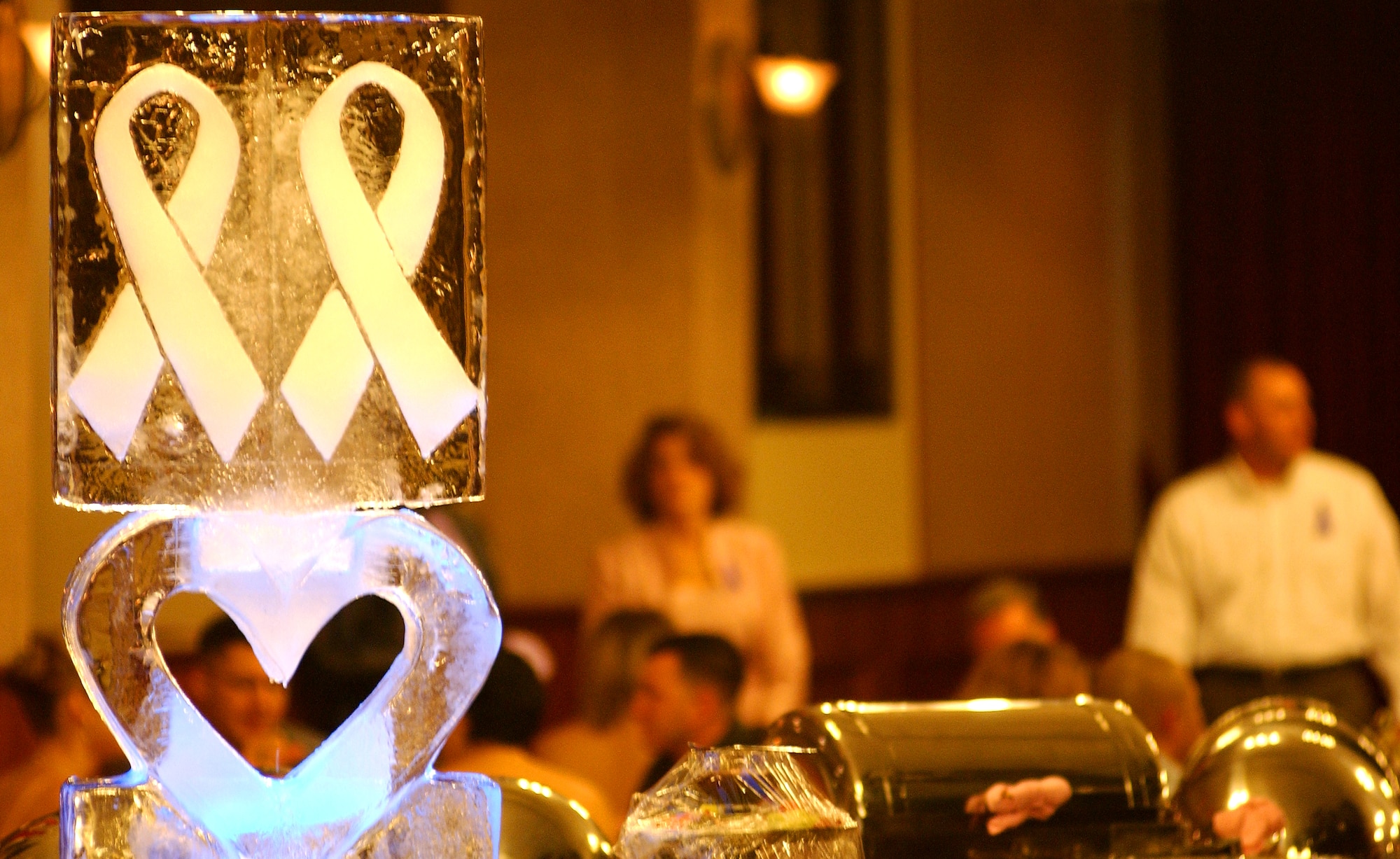 In an effort to promote community health and wellness, military members and their families attended the Pink Dress, Purple Tie Gala at the Rocker NCO Club at Kadena Air Base Oct. 17.  (U.S. Air Force photo/Tech. Sgt. Rey Ramon) 