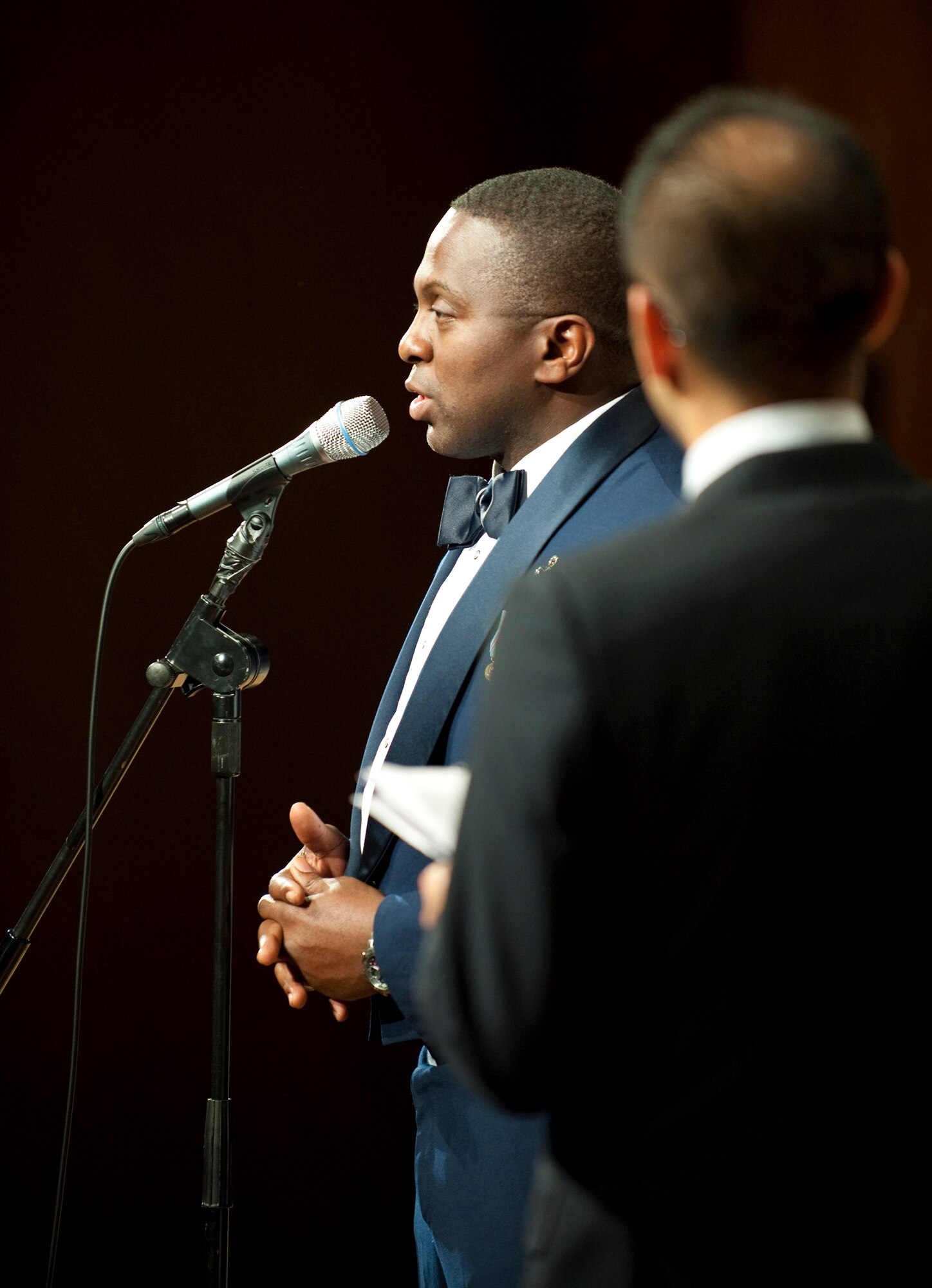 MISAWA AIR BASE, Japan -- Master Sgt. John Teamer, lead male vocalist for Pacific Air Forces show band, Greatlanders, introduces the band's next song at the Misawa International Center Oct. 17. Sergeant Teamer sang the traditional Japanese folk song "Sakura," which he had learned for the tour. (U.S. Air Force photo/Staff Sgt. Samuel Morse)