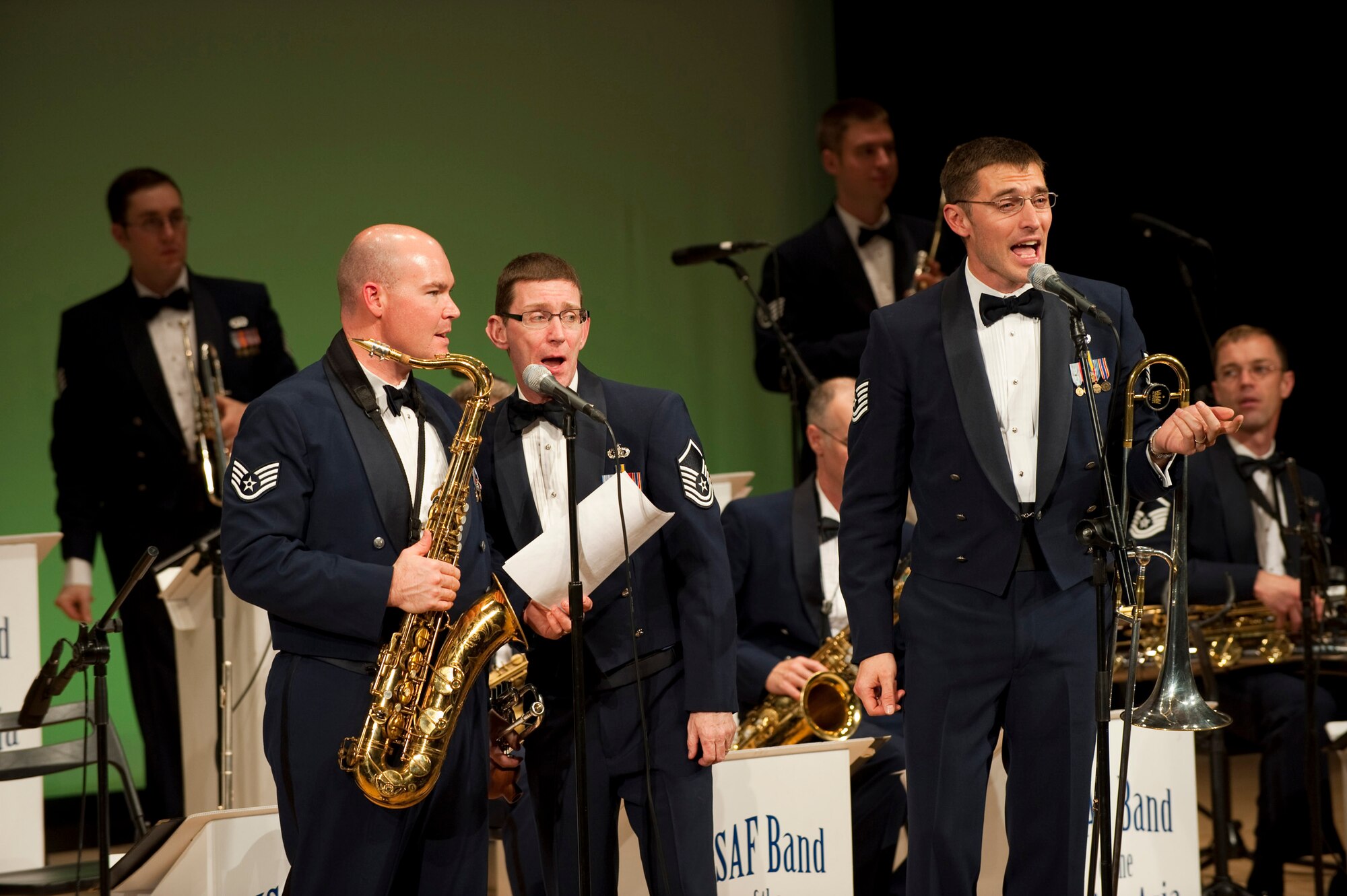 MISAWA AIR BASE, Japan -- Staff Sgt. Jeffrey Hall, Master Sgt. George Pierce and Tech. Sgt. David McCormick, Pacific Air Forces show band, Greatlanders, sing "Hit That Jive, Jack" at the Misawa International Center Oct. 17. A saxophonist, trumpeter and trombonist singing lead vocals demonstrates the versatility typical of Air Force bands. (U.S. Air Force photo/Staff Sgt. Samuel Morse)