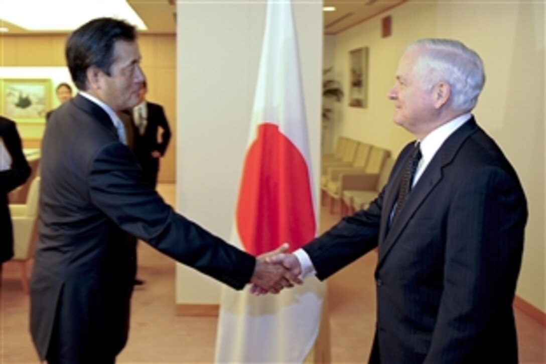 Defense Secretary Robert M. Gates is greeted by Foreign Affairs Minister Katsuya Okada on his arrival to the Japanese Ministry of Foreign Affairs in Tokyo, Oct. 20, 2009.  