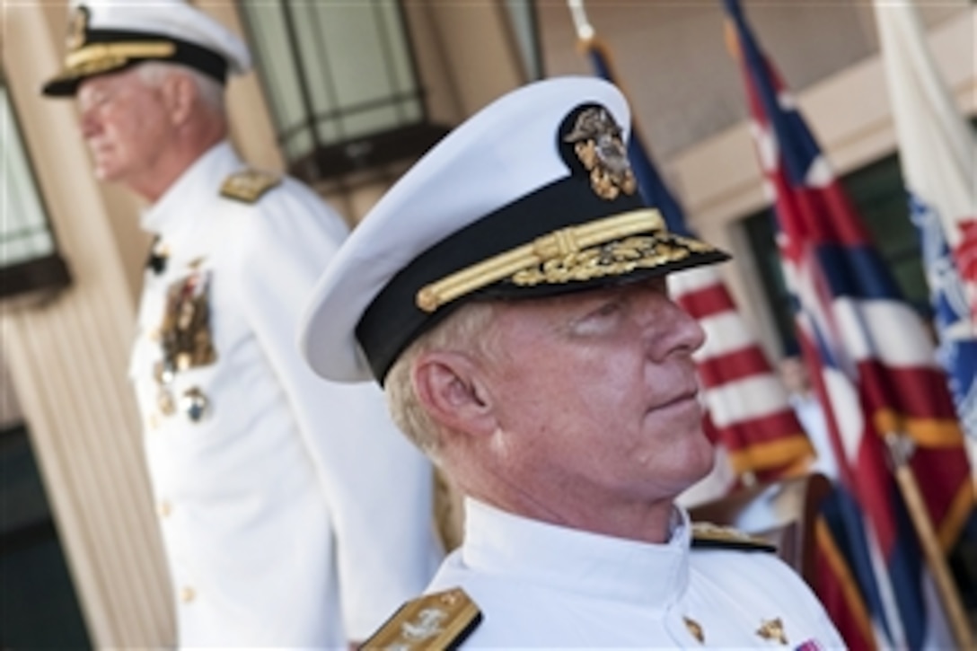 U.S. Navy Adm. Robert F. Willard, commander of U.S. Pacific Command, and U.S. Navy Adm. Timothy J. Keating depart at the conclusion of the U.S. Pacific Command change-of-command ceremony on Camp Smith, Hawaii, Oct. 19, 2009. Willard relieved Keating at the ceremony overseeing the Defense Department's largest geographical area of command.