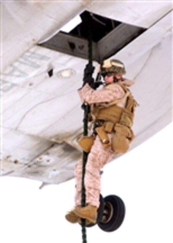 A U.S. Marine with the 11th Marine Expeditionary Unit fast-ropes out a CH-46E Sea Knight helicopter onto the flight deck of the dock landing ship USS Rushmore (LSD 47) underway in the Pacific Ocean on Oct. 14, 2009.  The Rushmore, part of the Bonhomme Richard Amphibious Ready Group, is transiting through the U.S. Seventh Fleet area of operations and reports to the Commander, Amphibious Force Seventh Fleet.  