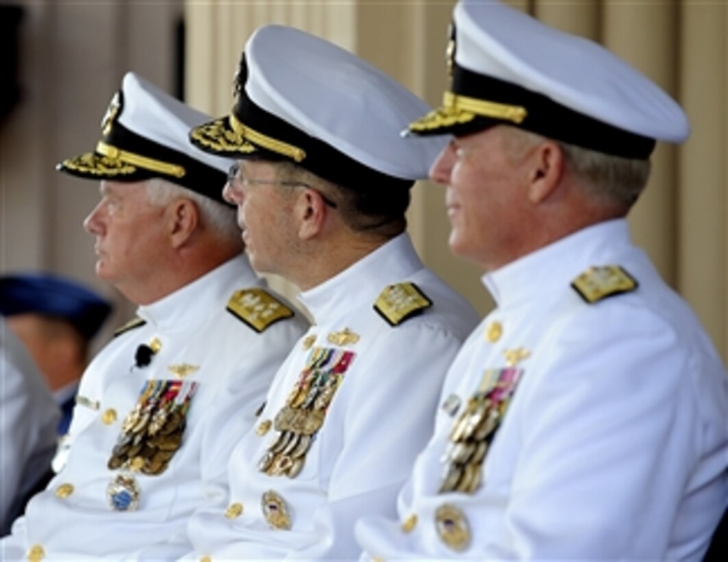 Outgoing Commander of Pacific Command Adm. Timothy J. Keating (left), Chairman of the Joint Chiefs of Staff Adm. Mike Mullen and incoming Pacific Command Commander Adm. Robert F. Willard (right) look on as Secretary of Defense Robert M. Gates gives his remarks during the Pacific Command change of command ceremony at Camp Smith in Honolulu, Hawaii, on Oct. 19, 2009.  