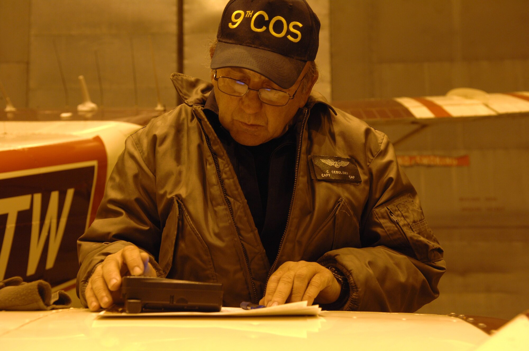 Civil Air Patrol Capt. Curtis Cebulski verfies flight coordinates before his flight Oct. 15, 2009, Eielson Air Force Base, Alaska. CAP particpated in RED FLAG-Alaska flying "low and slow" and providing valuable training to both the military and CAP pilots. The RF-A exercise provides unique opportunities to integrate various forces into joint, coalition and bilateral training from a simulated forward operating base. (U.S. Air Force photo/Airman 1st Class Rachelle Coleman)