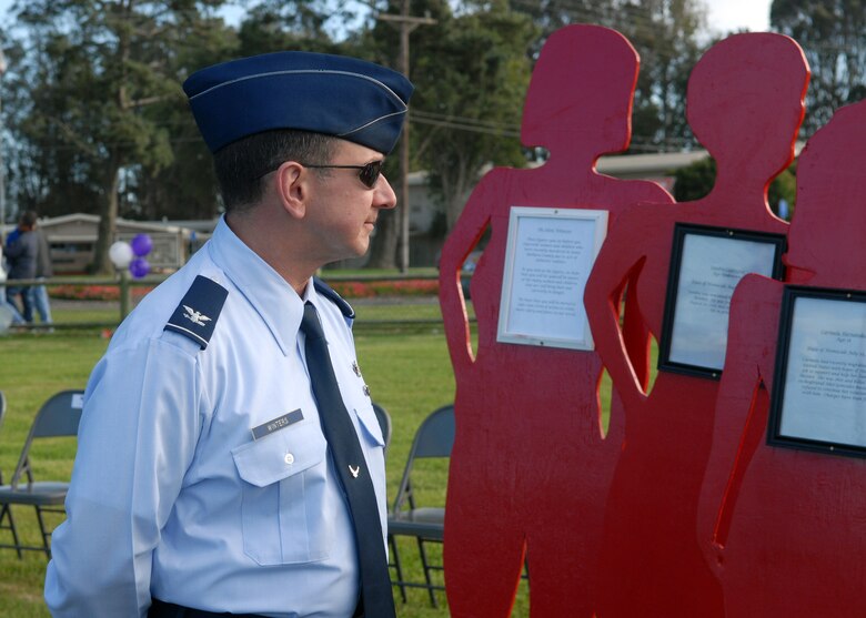 VANDENBERG AIR FORCE BASE, Calif. - As part of the Vandenberg's Community March Against Violence and Memorial Ceremony here Tuesday, Oct. 20, 2009, Col. Steven winters, the 30th Space Wing vice commander, observes the Silent Witnesses silhouettes. The silhouettes were displayed as a memorial to those who have died as a result of domestic violence and as a chance to raise awareness of the effects of domestic violence. (U.S. Air Force photo/ Airman 1st Class Angelina Drake)
