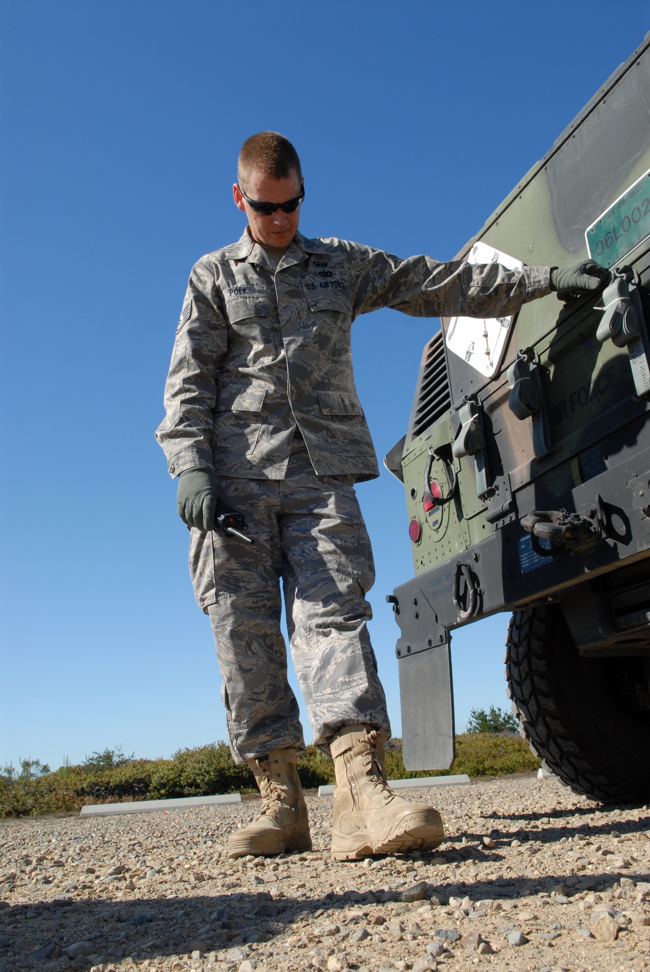 VANDENBERG AIR FORCE BASE, Calif. - Awaiting further instruction, Staff Sgt. Jason Polk, of the 30th Security Forces Squadron, listens intently to his radio so the he may proceed with the next phase of an exercise preformed here Tuesday, Oct. 20, 2009.  The annual Emergency Operations Staff Assistant Visit was preformed as a preparation for the yearly visit of the Inspector General. (U.S. Air Force photo/Airman 1st Class Angelina Drake)
