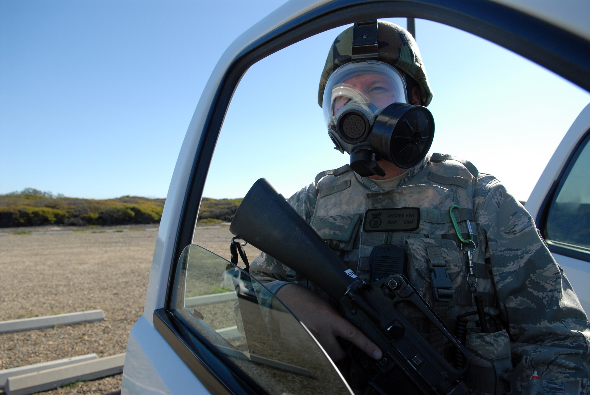 VANDENBERG AIR FORCE BASE, Calif. - While maintaining visual contact with a hostage, Staff Sgt. Ken Rhodes, of the 30th Security Forces Squadron awaits further instructions during the annual Emergency Operations Staff Assistant Visit here Tuesday, Oct. 20, 2009.The exercise is preformed as preparation for the yearly visit of the Inspector General. (U.S. Air Force photo/Airman 1st Class Angelina Drake)
