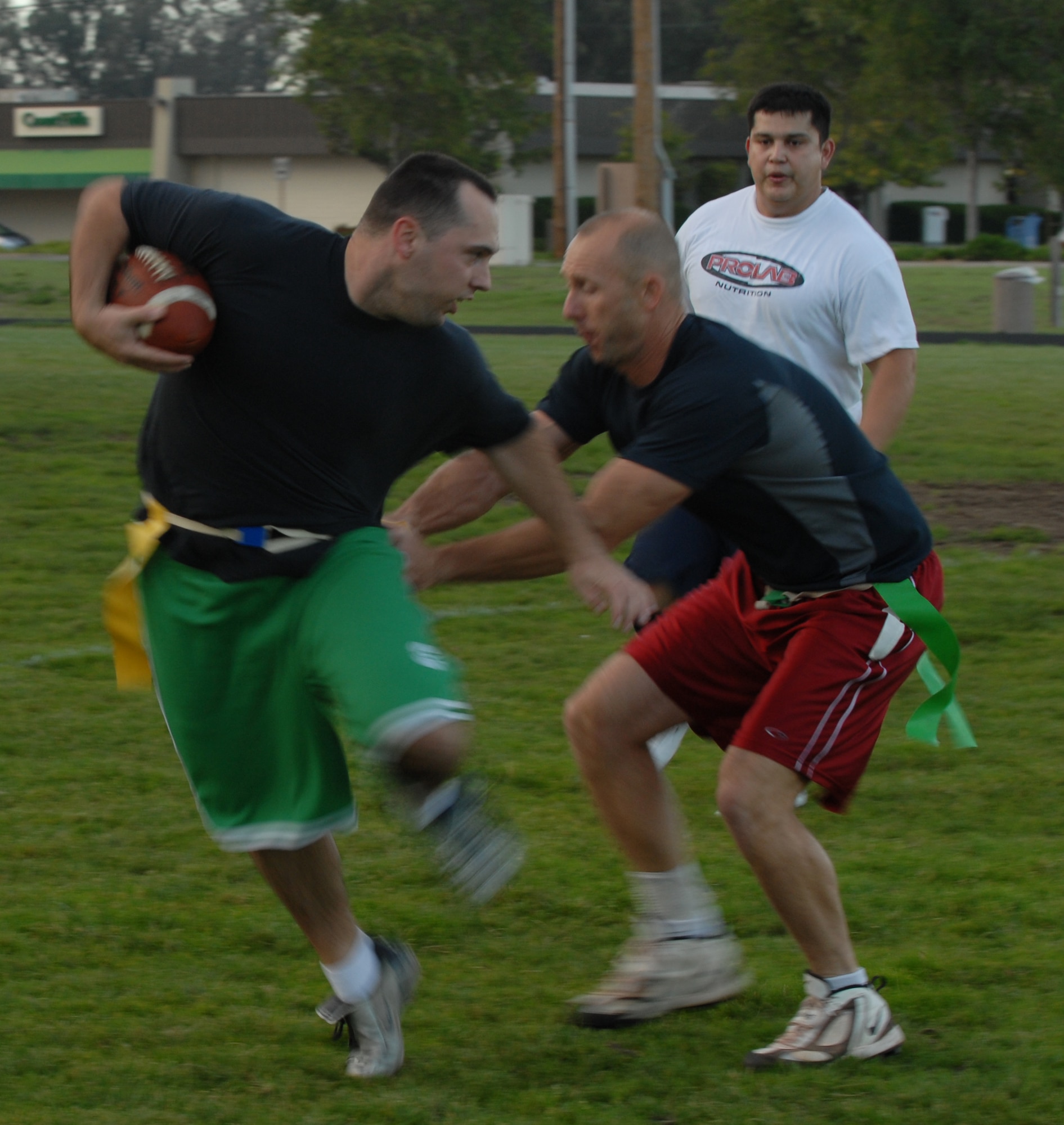 VANDENBERG AIR FORCE BASE, Calif. -- Staff Sgt. Dustin Huss, the 14 Air Force quarterback, runs to the in-zone for a touchdown during a flag football game here on Tuesday, Oct. 20, 2009. The 14th Air Force came out on top 18-7, with a win over the Launch Group. For more information on intramural sports call the base fitness center at 805-606-3832. (U.S. Air Force photo/Senior Airman Antoinette Lyons)

