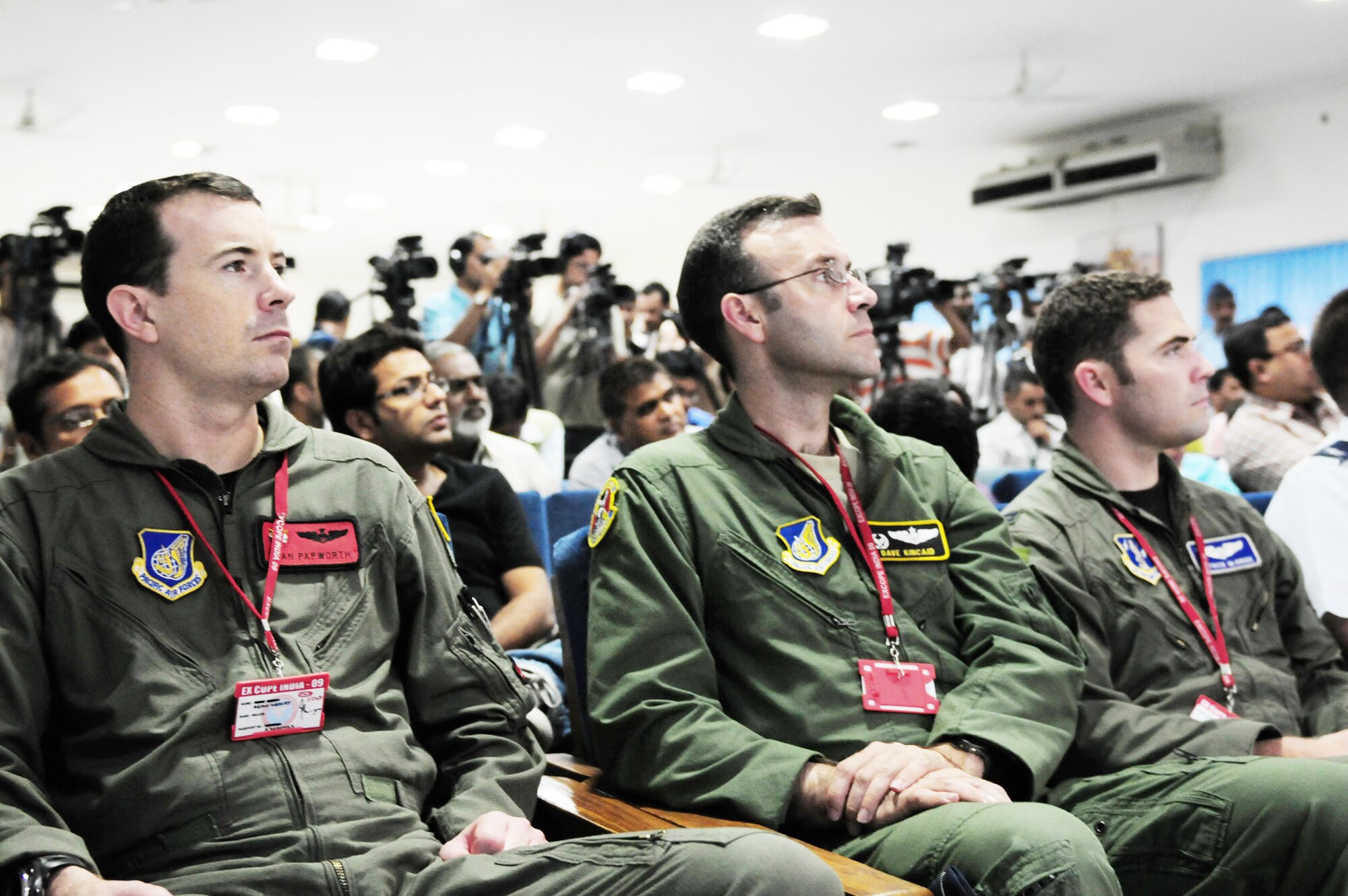 Maj. Sean Papworth (L), Lt. Col. Dave Kincaid and Capt. Patrick McBride standby to give aircraft related expertise during a Cope India press conference Oct. 19, 2009, at Air Force Station Agra, India. More than 150 U.S. Air Force and Army personnel are participating in Cope India, a United States and India airlift exercise that provides training for humanitarian assistance and disaster relief operations. Major Papworth is from the 535th Airlift Squadron at Hickam Air Force Base, Hawaii; Colonel Kincaid is from the 36th AS at Yokota Air Base, Japan; Captain McBride is from the 115th AS at Channel Islands Air National Guard Station, Port Hueneme, Calif. (U.S. Air Force photo/Capt. Genieve David)