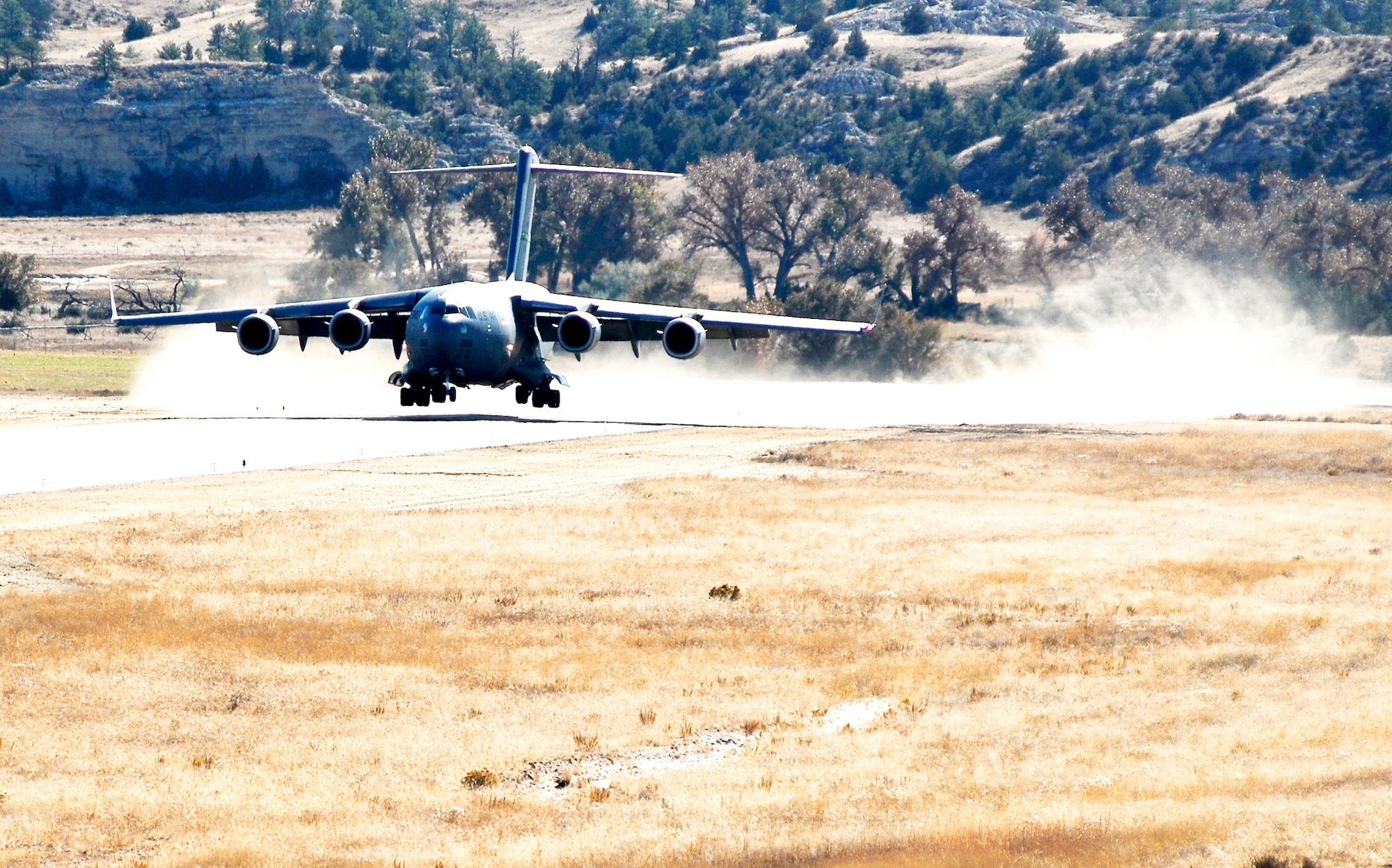 A C-17 Globemaster III from McChord Air Force Base, Wash., lands at the Wyoming National Guard's Guernsey Army Airfield in Guernsey, Wyo., Oct. 17, 2009, during the official opening of the updated airstrip now capable of handling the massive cargo aircraft. The airstrip is now able to park up to 23 fixed-wing aircraft, including three C-17s.  In addition to the civilian-military airstrip, Camp Guernsey also boasts nearly 70,000 acres of terrain and supports approximately 65 square miles of restricted air space up to 30,000 feet. (U.S. Army photo/Brandon Quester)