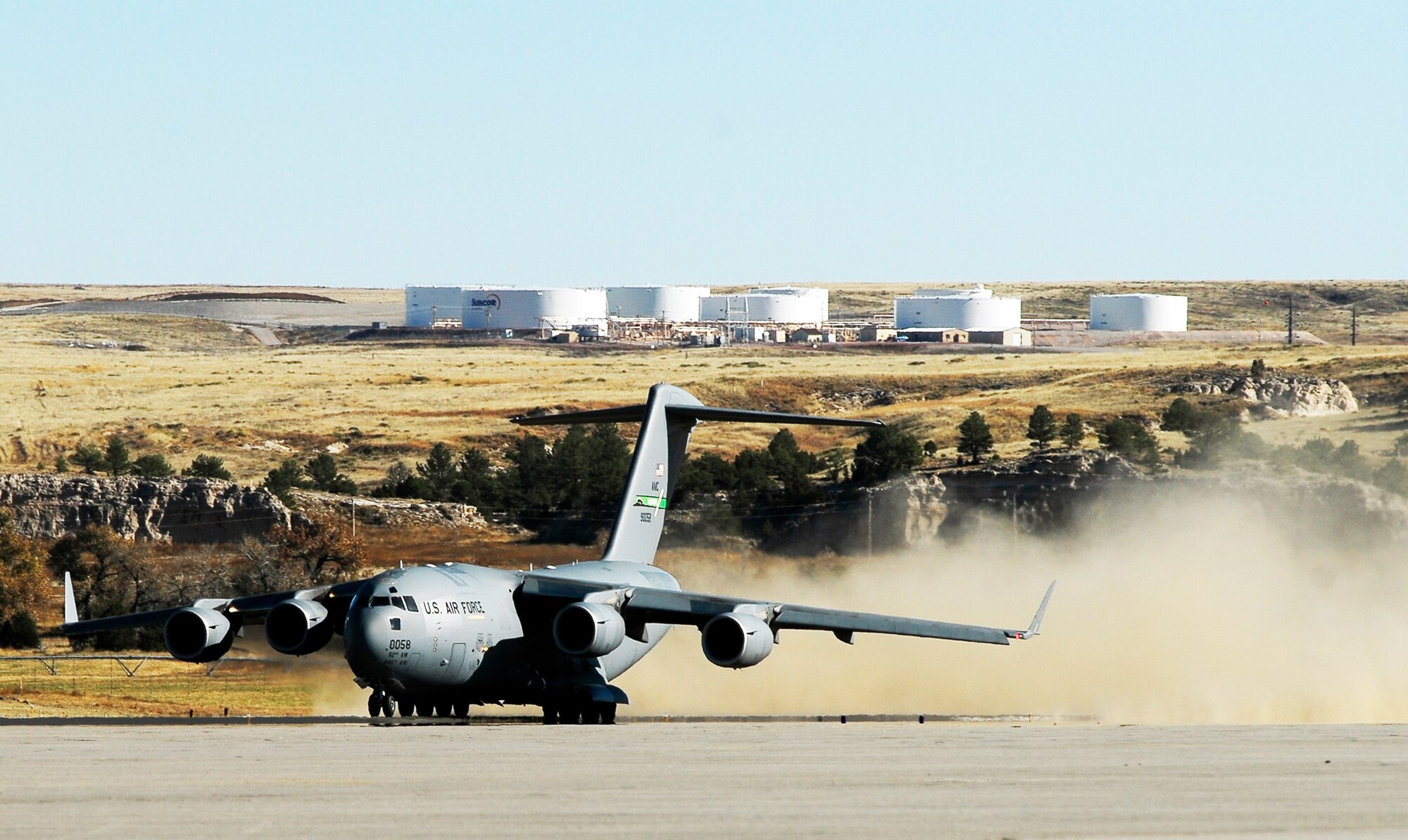 A C-17 Globemaster III from McChord Air Force Base, Wash., takes off from the Wyoming National Guard's Guernsey Army Airfield in Guernsey, Wyo., Oct. 17, 2009, during the official opening of the updated airstrip now capable of handling the massive cargo aircraft. The airstrip is now able to park up to 23 fixed-wing aircraft, including three C-17s.  In addition to the civilian-military airstrip, Camp Guernsey also boasts nearly 70,000 acres of terrain and supports approximately 65 square miles of restricted air space up to 30,000 feet. (U.S. Army photo/Brandon Quester)