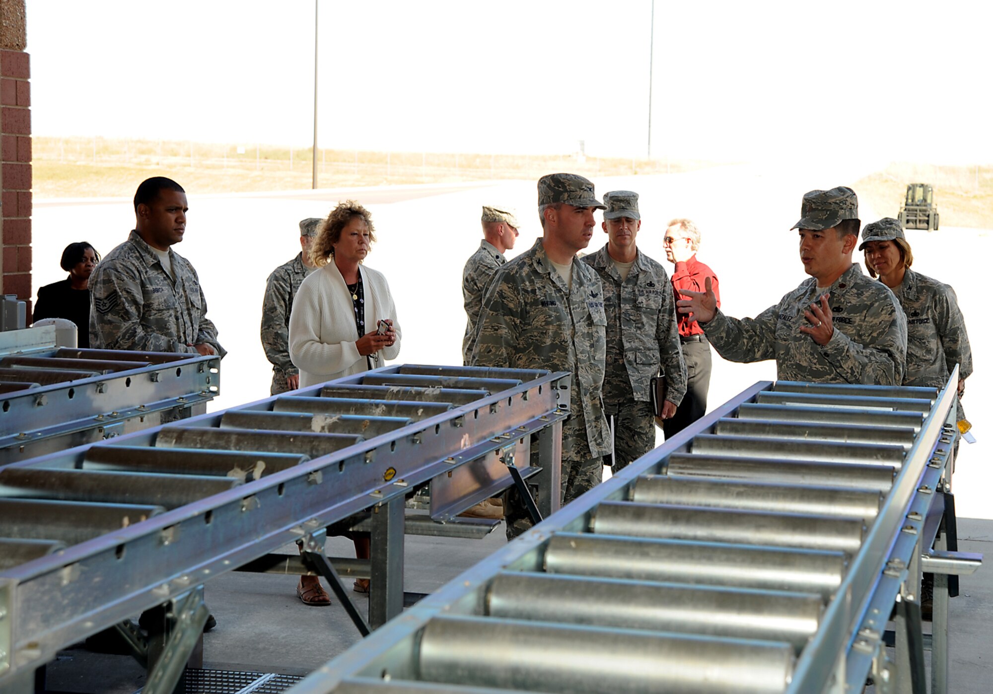PETERSON AIR FORCE BASE, Colo. -- Maj. Jerry Gonzalez, 21st Logistics Readiness Squadron commander (right), explains to Col. Stephen Whiting, 21st Space Wing commander, the impact of operations the 21st LRS provides during Army deployments including passenger and cargo movements. Colonel Whiting toured the new Arrival/Departure Airfield Control Group facility Oct. 5. The 21st SW deploys about 700 Airmen each year as part of its mission to provide well-trained Warrior Airmen. The A/DACG is located on the south side of the Colorado Springs Airport and is supported by the 21st LRS. (Air Force photo by Roberta McDonald)