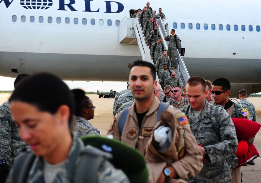 DYESS AIR FORCE BASE, Texas -- Airmen from the 317th Airlift Group return to Dyess Air Force Base after a six month deployment to Ali Al Salem Air Base, Kuwait, here Oct. 20. Approximately 155 Airmen deployed in June to fly and maintain C-130 Hercules Aircraft in support of Operations Enduring and Iraqi Freedom. (Air Force photo by Senior Airman Stephen Reyes)
