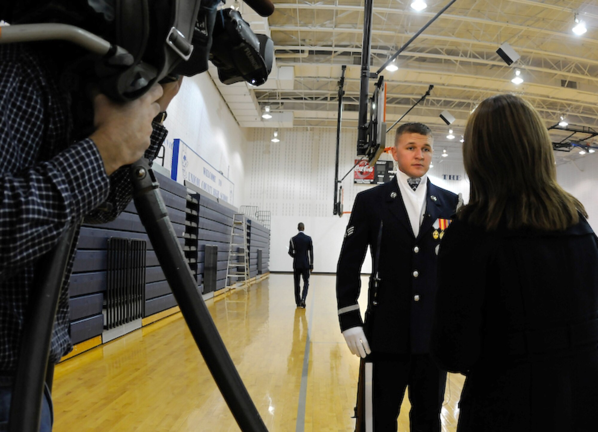 Senior Airman Aaron Fowler, United States Air Force Honor Guard Drill Team trainer, does an interview with the local NBC news affiliate prior to the Drill Teams performance at his alma mater and the last stop on the tour, Unicoi County High School, Erwin, Tenn. The team spent nine days traveling through the Carolinas and Tennessee, performing at Drill Team members’ former high schools, in addition to their typical base and air show performances. Performing for these students helped the Drill Team inspire and communicate at a more familiar level. (U.S. Air Force photo by Senior Airman Alexandre Montes)