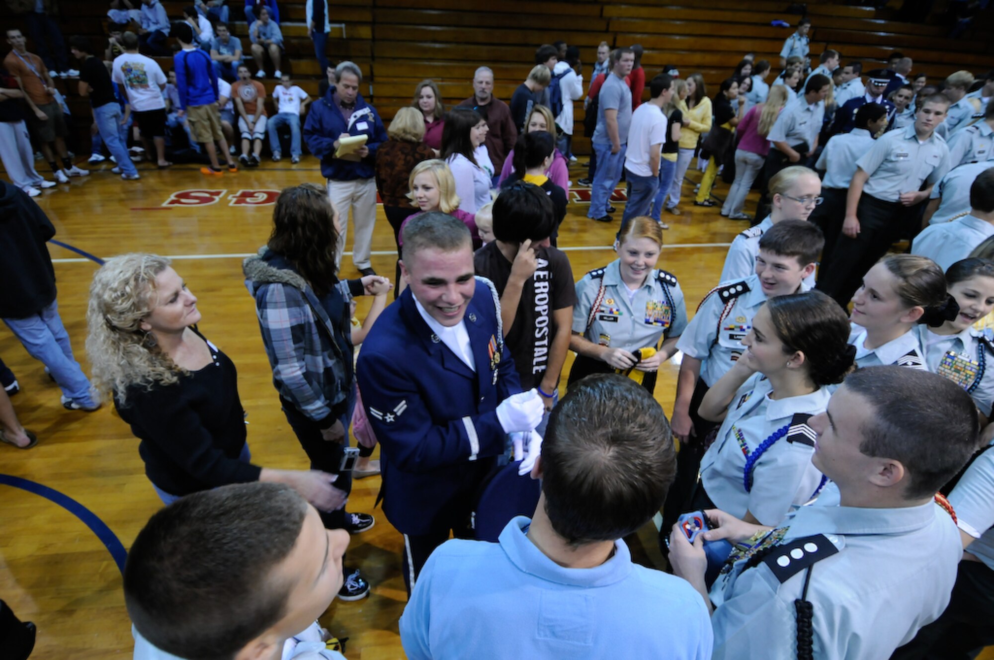 Airman 1st Class Rion Ehrman, United States Air Force Honor Guard Drill Team, speaks Oct. 14 with the current students of his alma mater, East Rowan High School, Rockwell, N.C., about joining the Air Force. The team spent nine days traveling through the Carolinas and Tennessee, performing at Drill Team members’ former high schools, in addition to their typical base and air show performances. Performing for these students helped the Drill Team inspire and communicate at a more familiar level. (U.S. Air Force photo by Senior Airman Alexandre Montes)