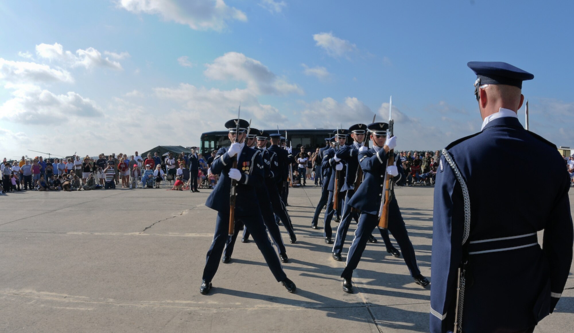 The United States Air Force Honor Guard Drill Team performs at the Joint Air National Guard Air Show at Pope Army Airfield, S.C on Oct. 11. The Drill Team supported the air show and performed for two days, drawing a large crowd. The team spent nine days traveling through the Carolinas and Tennessee, performing at Drill Team members’ former high schools, in addition to their typical base and air show performances. Performing for these students helped the Drill Team inspire and communicate at a more familiar level. (U.S. Air Force photo by Senior Airman Alexandre Montes)
