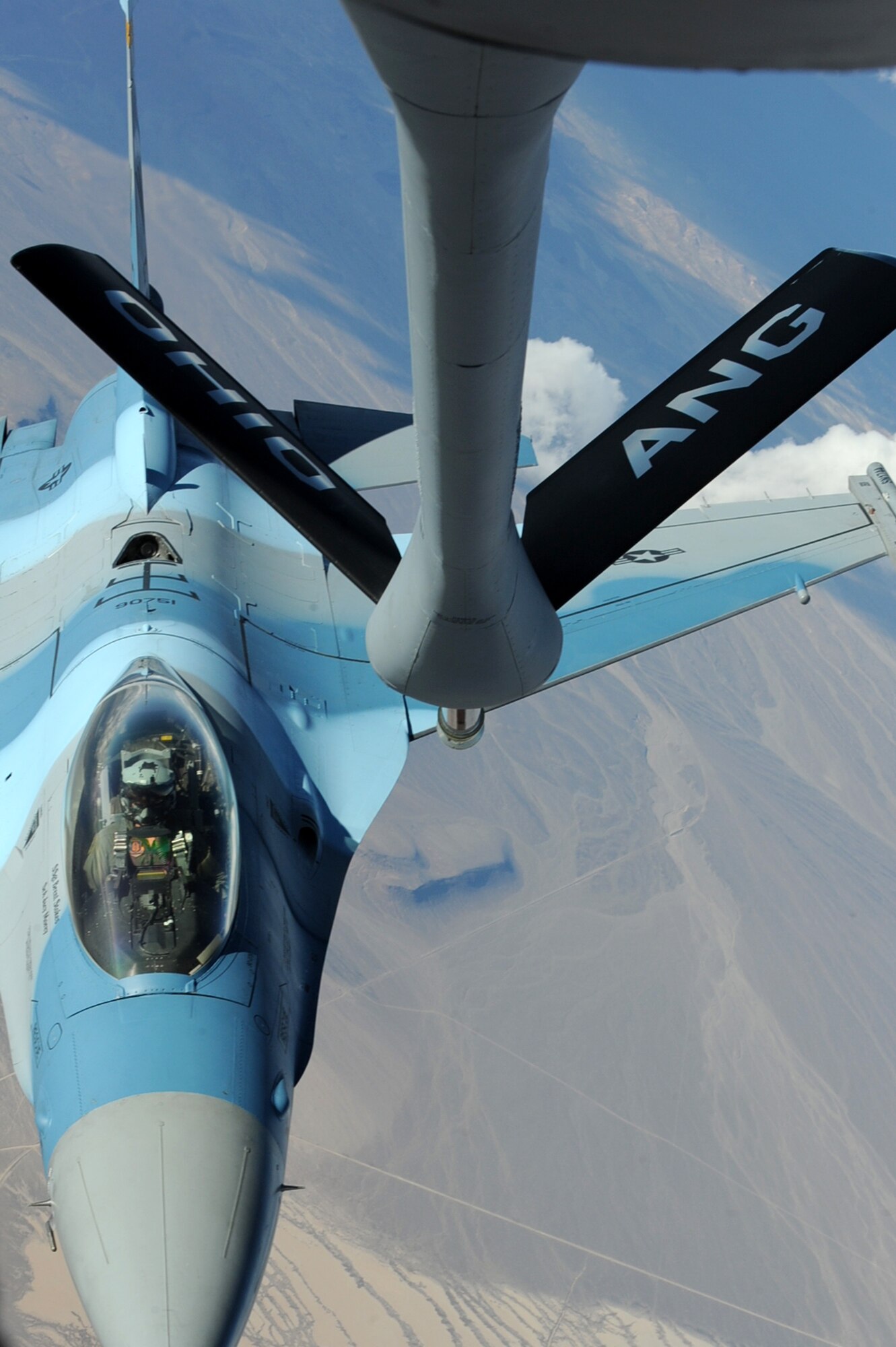 NELLIS AIR FORCE BASE, Nev.-- An F-16 Fighting Falcon Aggressor flies toward the boom of an Ohio Air National Guard KC-135 Stratotanker over the Nevada Test and Training Range Oct. 19, 2009. Red  Flag 10-01 is a realistic combat training exercise involving the air forces of the United States and its allies. The exercise is conducted on the 15,000-square-mile Nevada Test and Training Range, north of Las Vegas. 
(U.S. Air Force Photo by Airman 1st Class Jamie Nicley)