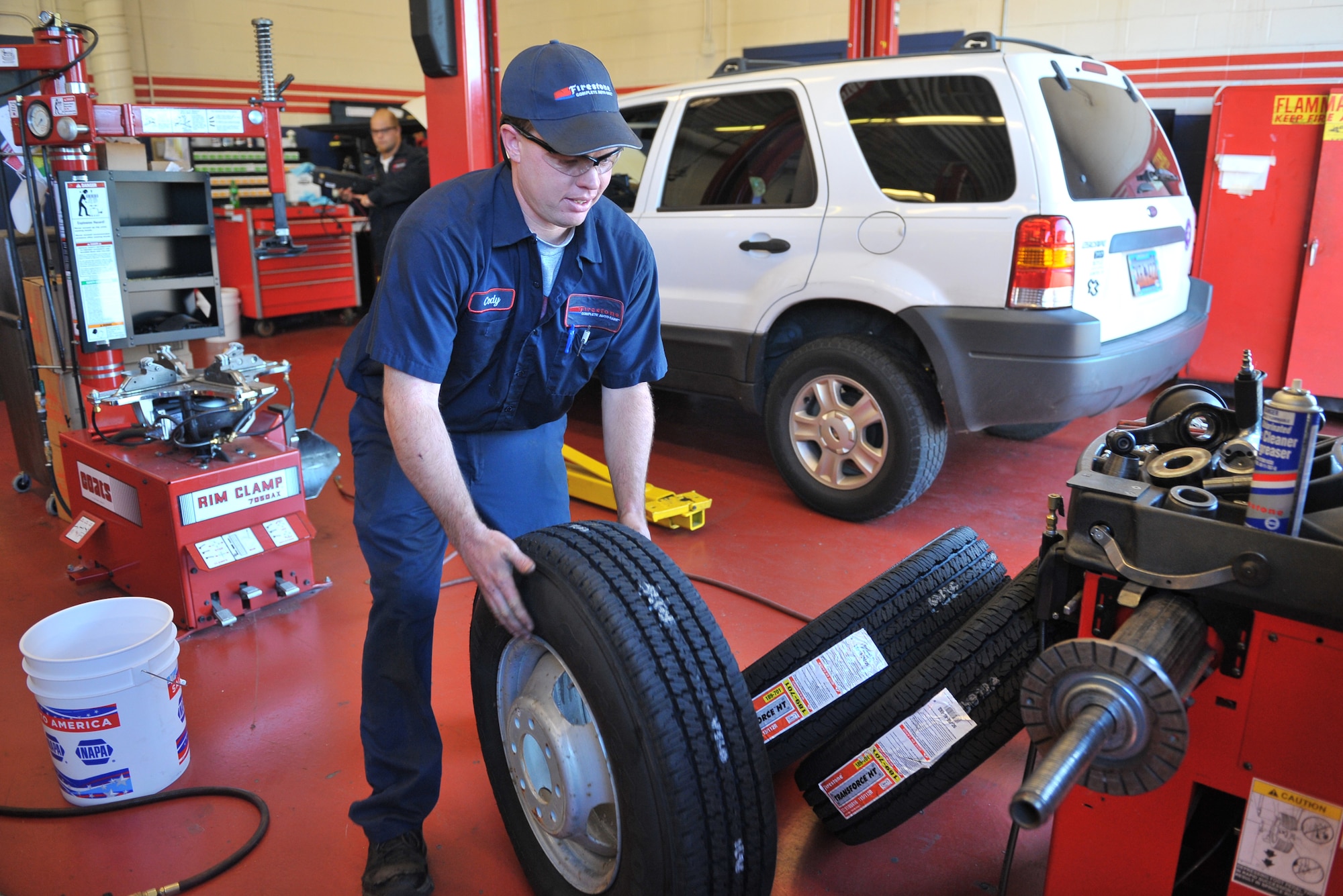 SHAW AIR FORCE BASE, S.C. -- Cody Steffen lines up new Firestone tires, Oct. 21. Firestone Car Care Centers are opening at 30 Army and Air Force Exchange Service locations across the United States. (U.S. Air Force photo/Senior Airman Kathrine McDowell) 