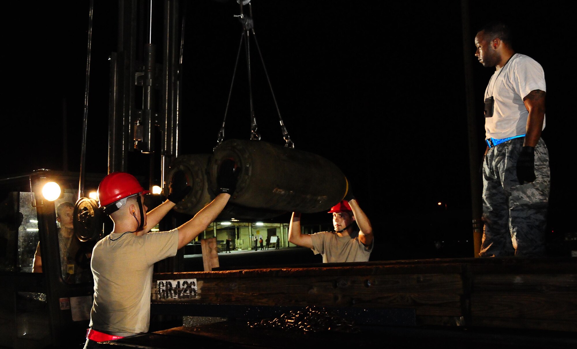 ANDERSEN AIR FORCE BASE, Guam - Airman from the 36th Munitions Squadron conventional maintenance crew beddown a M-117 general purpose bomb during the en were evaluated on the length of time it took to build, beddown, transport and upload the bomb safely. (U.S. Air Force photo by Senior Airman Nichelle Anderson)