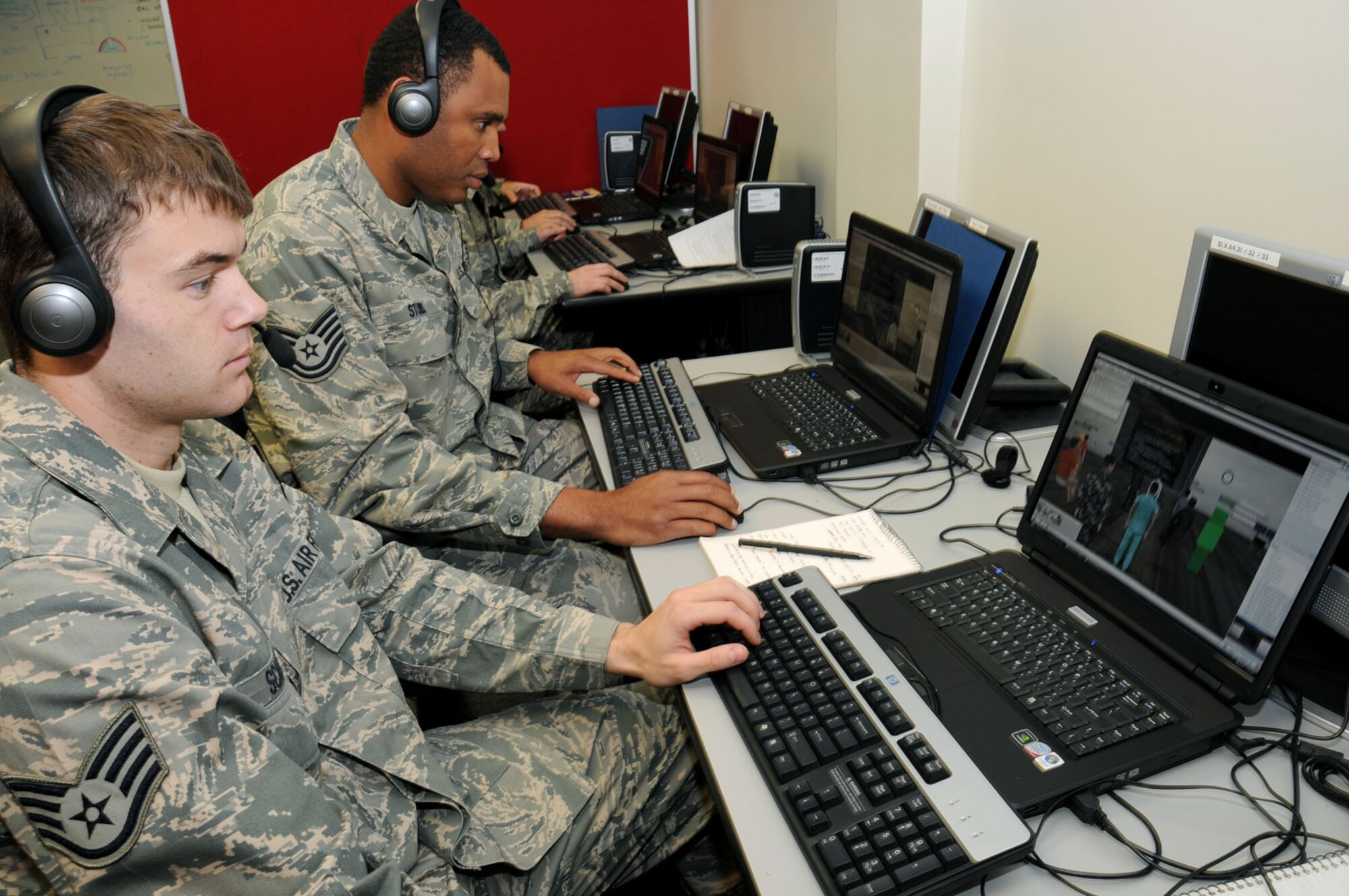 Staff Sgt. Robert Scanlon, left, Elmendorf Air Force Base, Alaska, and Tech. Sgt. Ernest Stubbs, McGuire AFB, N.J., participate in a virtual classroom on the first day of the MyBase course delivery.  (U.S. Air Force photo by Kemberly Groue)