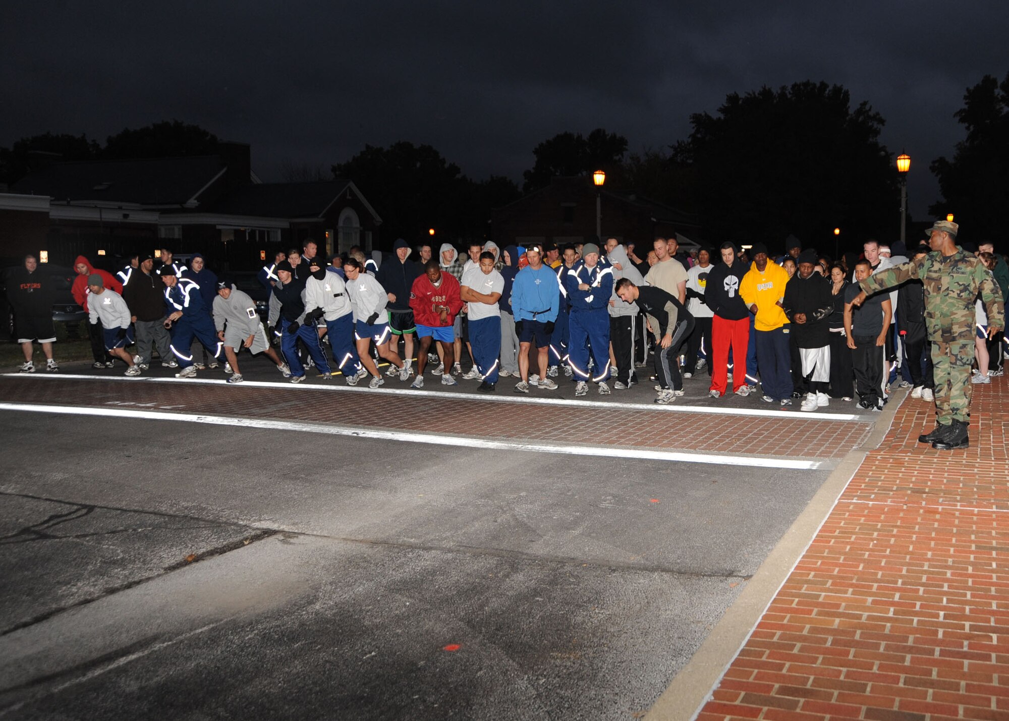 Scott AFB, Ill,; Monster Mash Bash participants line up at the starting line of the run/walk at the Parade Grounds Friday morning during the 45 degree weather. The Fitness Center hosted the 1.5 fun run/walk to promote physical fitness while having a good time  (U.S. Air Force Photo by Airman 1st Class Tristin English)