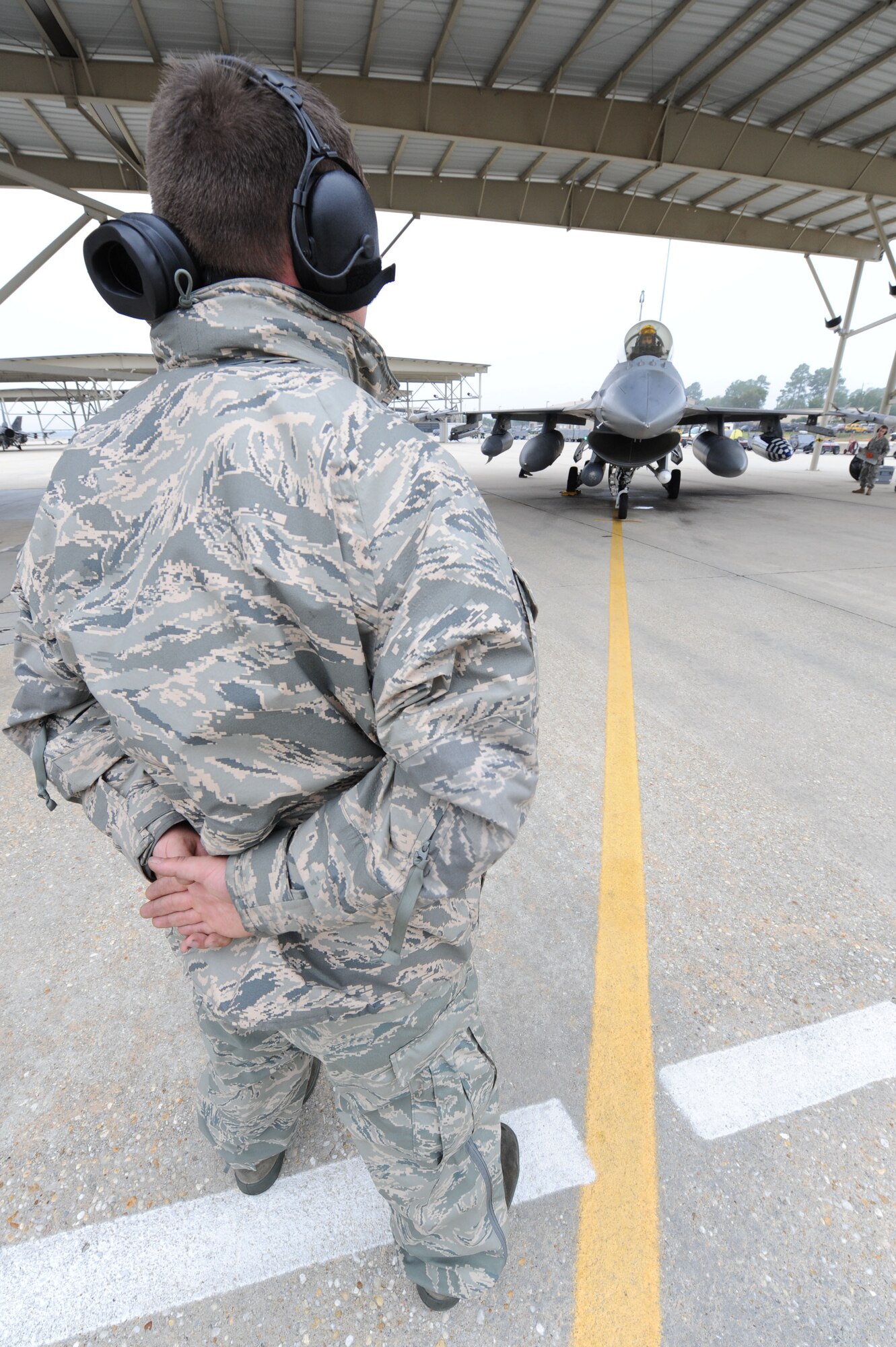SHAW AIR FORCE BASE, S.C. -- Senior Airman Nicholas Chapmon, 20th Aircraft Maintenance Squadron, stands in front of the jet as he prepares the jet to taxi out Oct 16. Airmen of the 55th departed for Las Vegas, Nev., to participate in a Red Flag exercise. (U.S. Air Force Photo/Senior Airman David Minor)