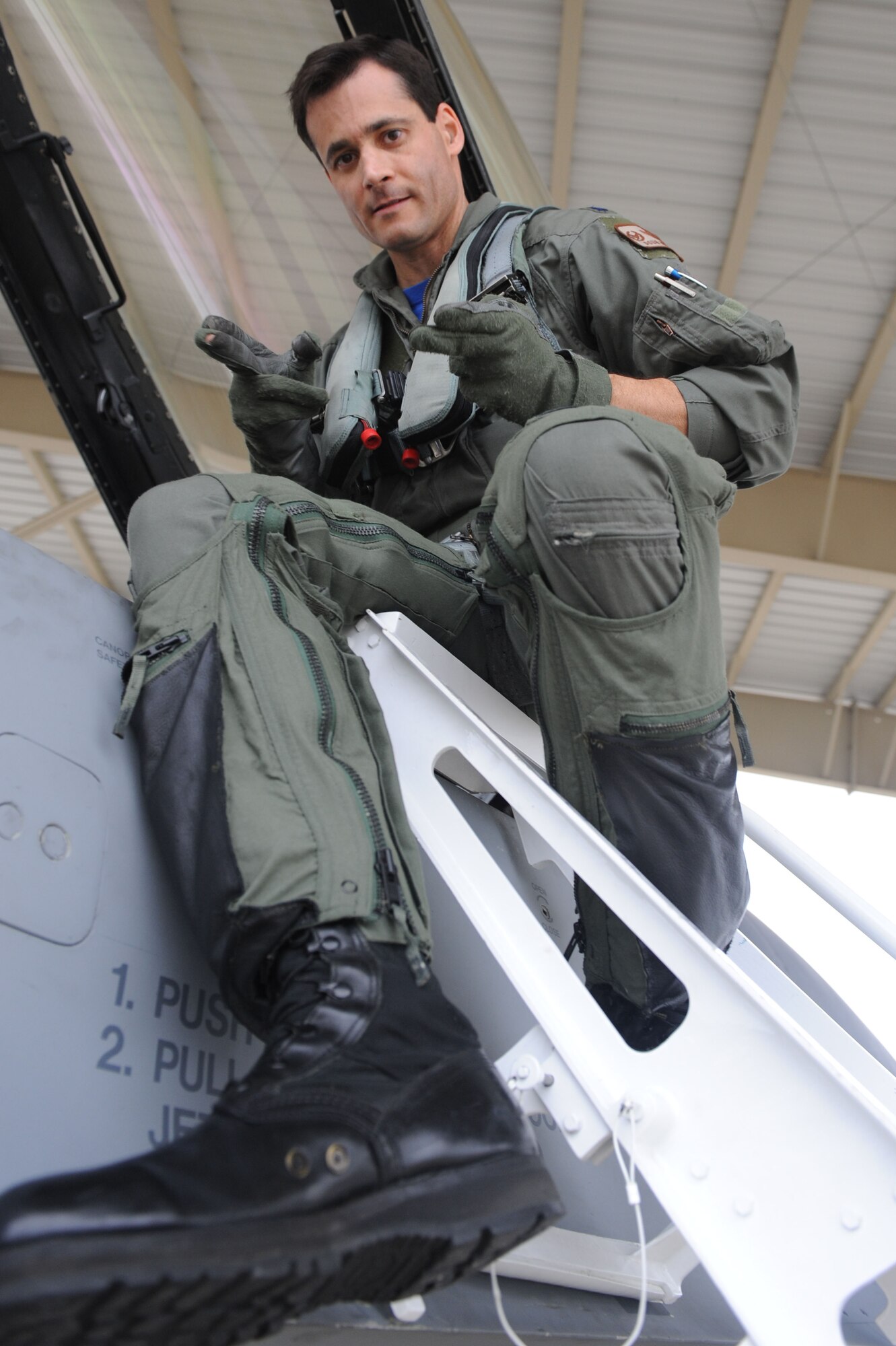 SHAW AIR FORCE BASE, S.C. -- Lieutenant Col. Douglas DeMaio, 55th Fighter Squadron commander, gives the signature "shooter" signal of the "Gamblers" as he climbs into his jet Oct 16. Airmen of the 55th departed for Las Vegas, Nev., to participate in a Red Flag exercise. (U.S. Air Force Photo/Senior Airman David Minor)