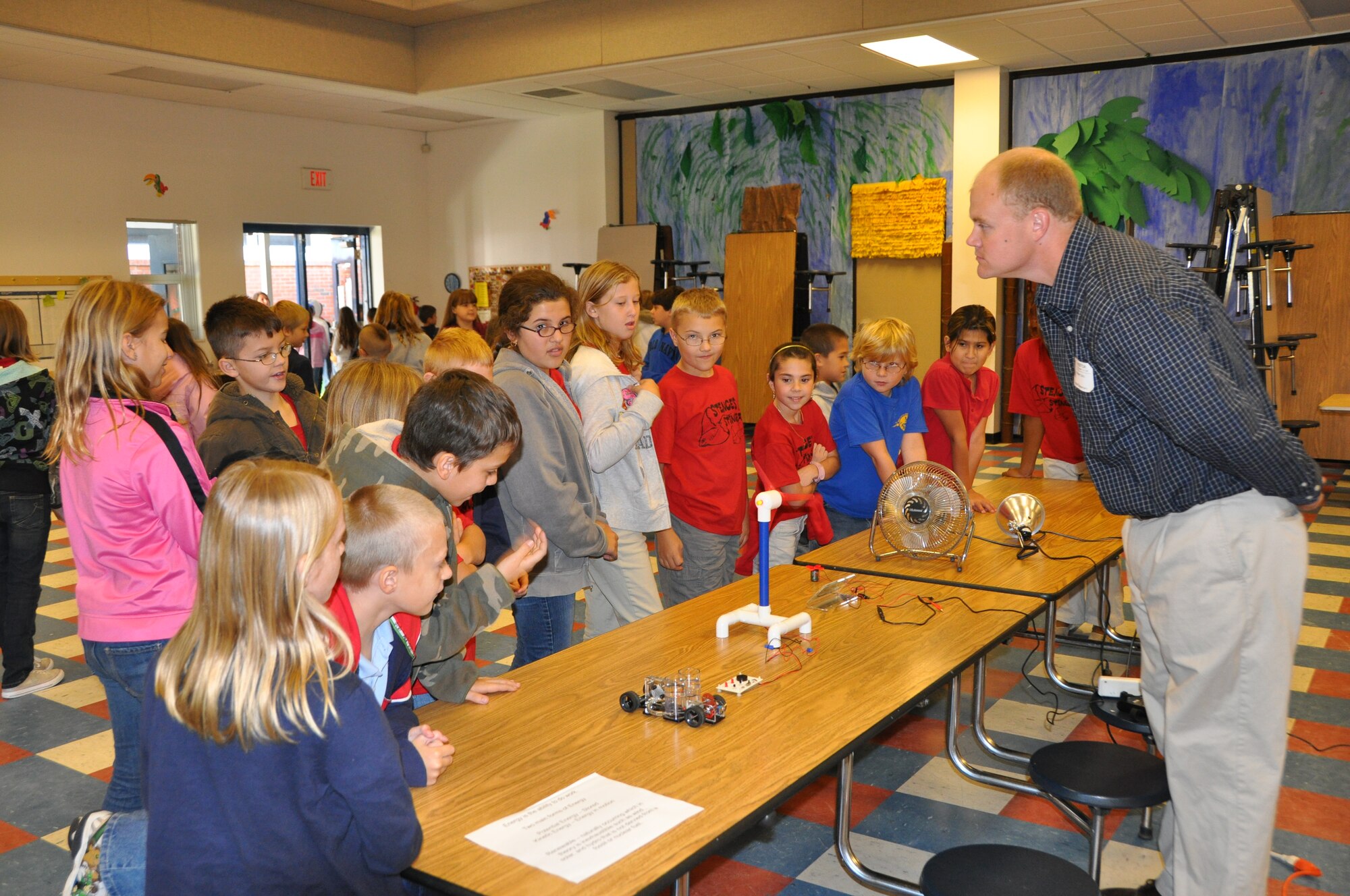 Fourth graders gather to watch an Energy Demonstration at Tyndall Elementary School Oct. 20 to celebrate Energy Awareness Month.  Bobby Diltz, Air Force Research Laboratory Energy Systems Research Group technical lead, briefed the children on energy topics such as wind power, hydrogen powered cars and solar power.  (U.S. Air Force photo/Airman 1st Class Veronica McMahon)
