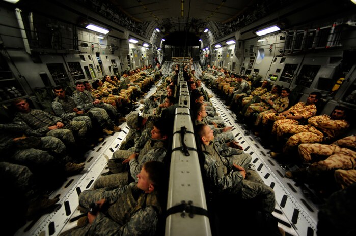 International paratroopers fly aboard a Charleston C-17 near Fort Bragg, N.C., during the preparation phase for Exercise Bright Star Oct. 8. Exercise Bright Star is a biennial, Joint Chiefs of Staff directed joint and coalition exercise designed to increase regional involvement in pursuit of improved security and defense capabilities. (U.S. Air Force photo/Staff Sgt. Jacob Bailey)