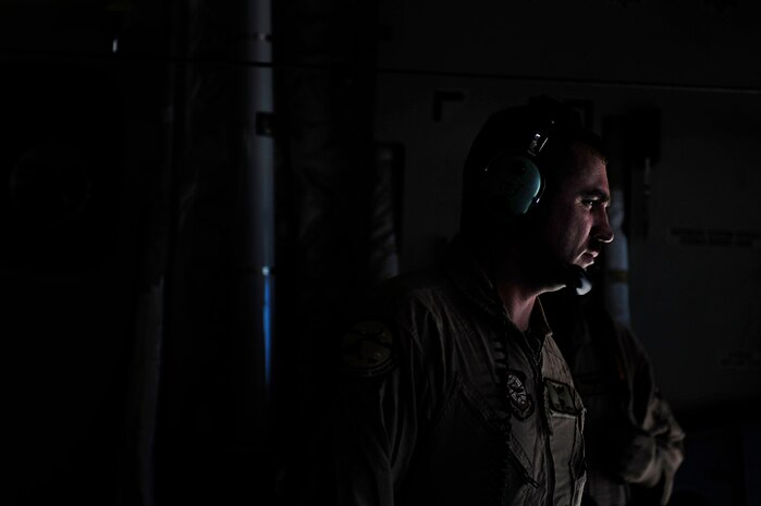 Tech. Sgt. Kevin Owens awaits soldiers boarding a Charleston C-17 aircraft at Pope AFB, N.C., before an airdrop mission during the preparation phase for Exercise Bright Star Oct. 8. Sergeant Owens is a loadmaster assigned to the 14th Airlift Squadron. (U.S. Air Force photo/Staff Sgt. Jacob Bailey)