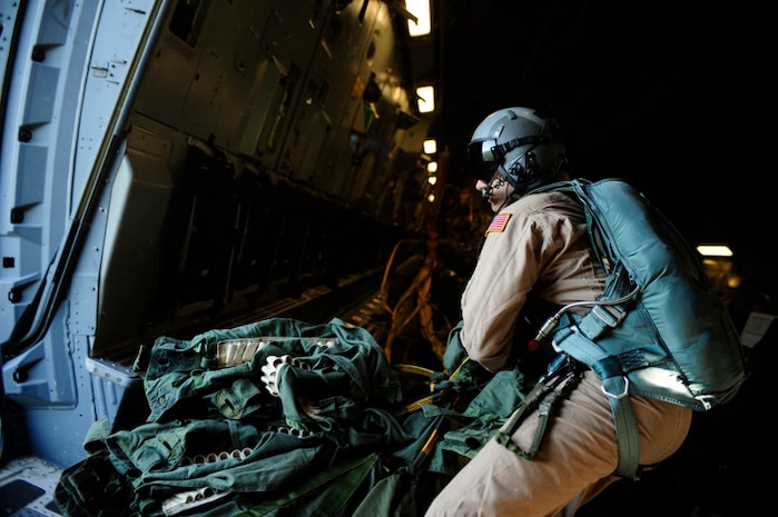 Staff Sgt. Matt Cunningham retrieves parachute bundles aboard a Charleston C-17 near Fort Bragg, N.C., during the preparation phase for Exercise Bright Star Oct. 8. Exercise Bright Star is part of U.S. Central Command's theater engagement strategy and is designed to improve readiness, interoperability and strengthen relationships between U.S., Egyptian and participating forces. Sergeant Cunningham is a loadmaster assigned to the 14th Airlift Squadron. (U.S. Air Force photo/Staff Sgt. Jacob Bailey)