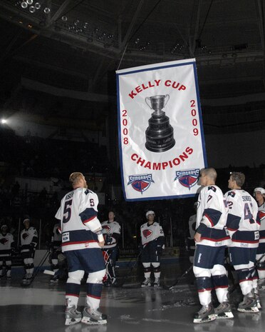 Members of the South Carolina Stingrays hockey team watch as the Kelly Cup Champions banner is raised into the rafters at the North Charleston Coliseum during their military appreciation night Oct. 16. The Stingrays hold two military appreciation events each season, with the next scheduled for March 12. (U.S. Air Force photo/Staff Sgt. Daniel Bowles)
