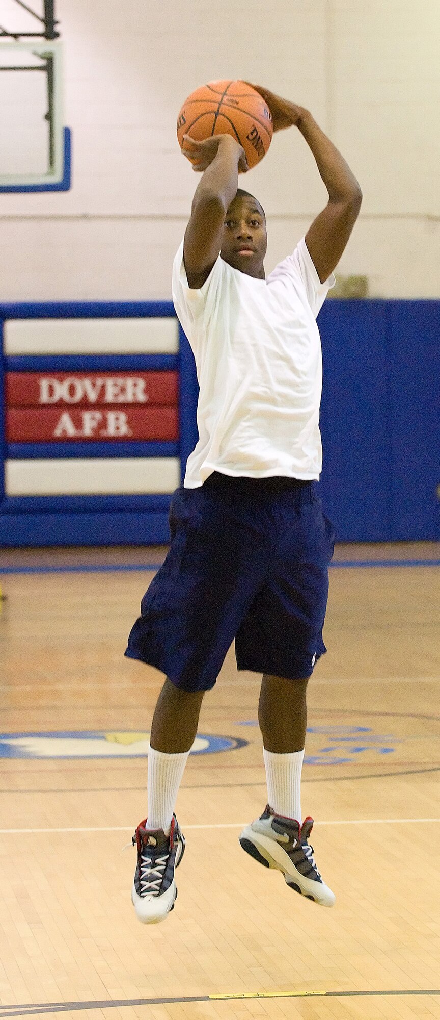 Airman 1st Class Derrick Raley, Air Force Mortuary Affairs Operations Center, prepares to shoot hoops for basketball hot shot in the Fitness Center gym Oct. 16 during Wing Sports Day. Team Dover Airmen participated in competitions including bowling, dodge ball and basketball. (U.S. Air Force photo/ Jason Minto)
