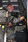 RAMSTEIN AIR BASE, Germany -- Air Force Reserve aircraft mechanics assigned to the 910th Airlift Wing use a flashlight to check the engine compartment as part of a basic post-flight inspection of a C-130 Hercules aircraft on the flightline here, Oct. 20, 2009. The aircraft and its crew, from Youngstown Air Reserve Station, Ohio, returned from an airlift mission to Tel Aviv, Israel. The YARS Airmen are participating in a deployment here in support of Operation Joint Enterprise, which provides airlift support throughout Europe and Africa. U.S. Air Force photo by Senior Airman Brenda Haines